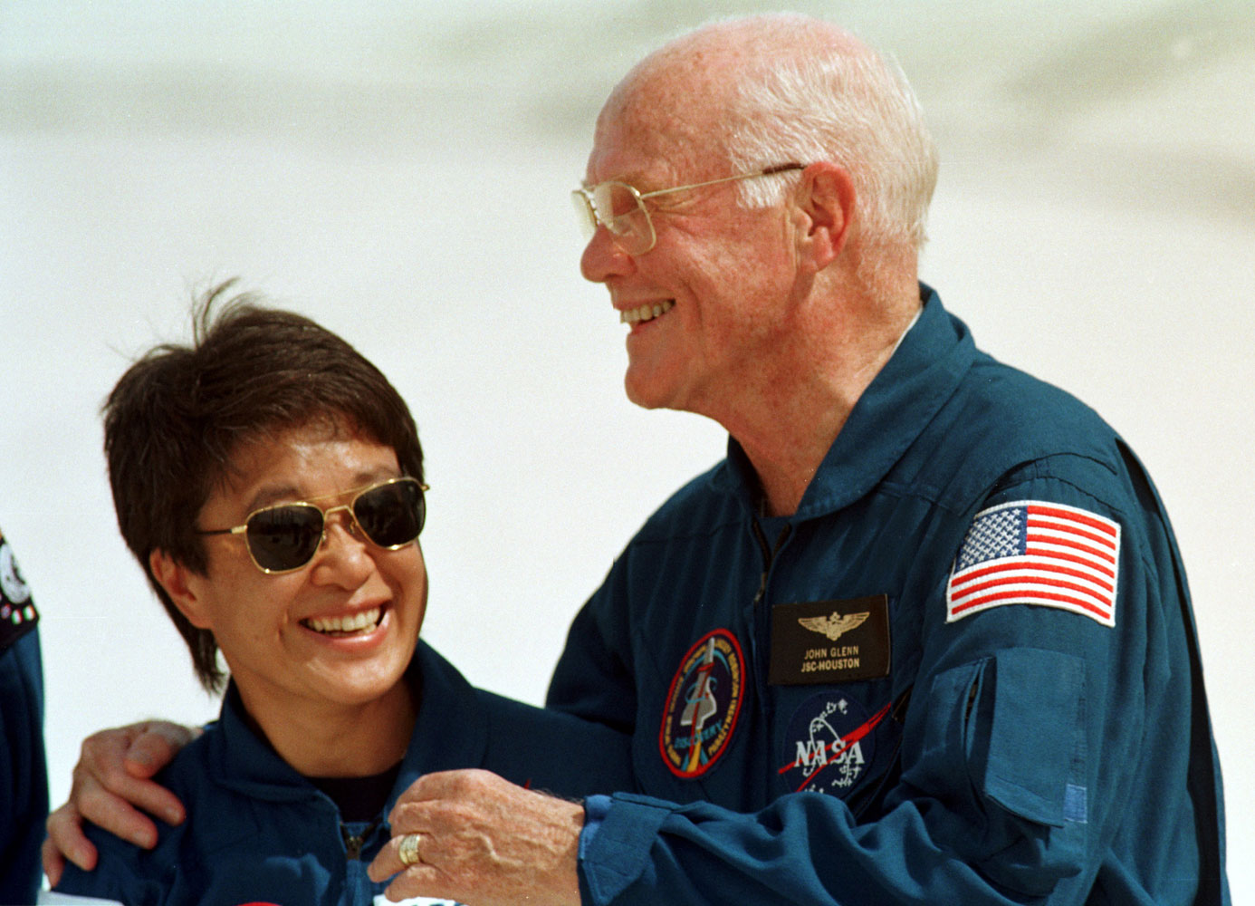 Japanese astronaut Chiaki Mukai and John Glenn at a press conference, on Oct. 8, 1998. Mukai was Japan's first woman in space.
