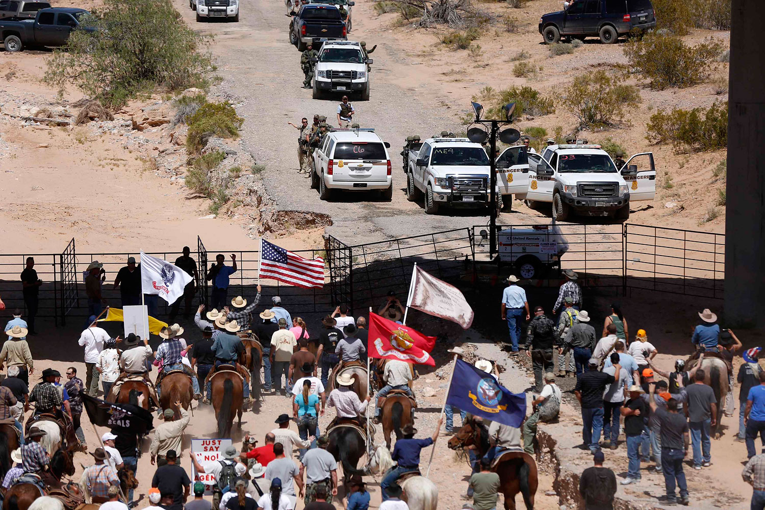Protesters gathered at the Bureau of Land Management's base camp, where cattle that were seized from rancher Cliven Bundy was being held, near Bunkerville, Nevada, April 12, 2014.