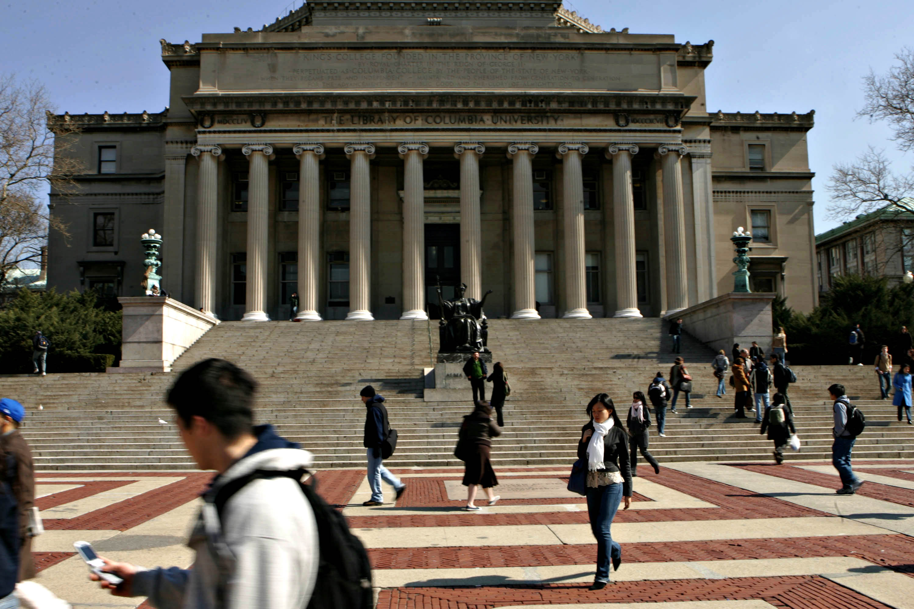 Students walk across the campus of Columbia University in Ne