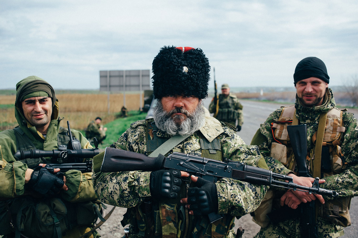 Alexander Mozhaev, a pro-Russian separatist whose photograph has appeared in numerous publications in recent days and who says he is not employed by the Russian state, stands with fellow separatists in the town of Slavyansk on April 20.