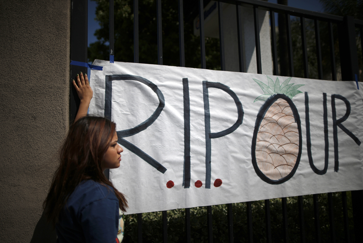 Students put up a sign for El Monte High School student Adrian Castro, outside the school in El Monte, California April 11, 2014. (Lucy Nicholson—Reuters)