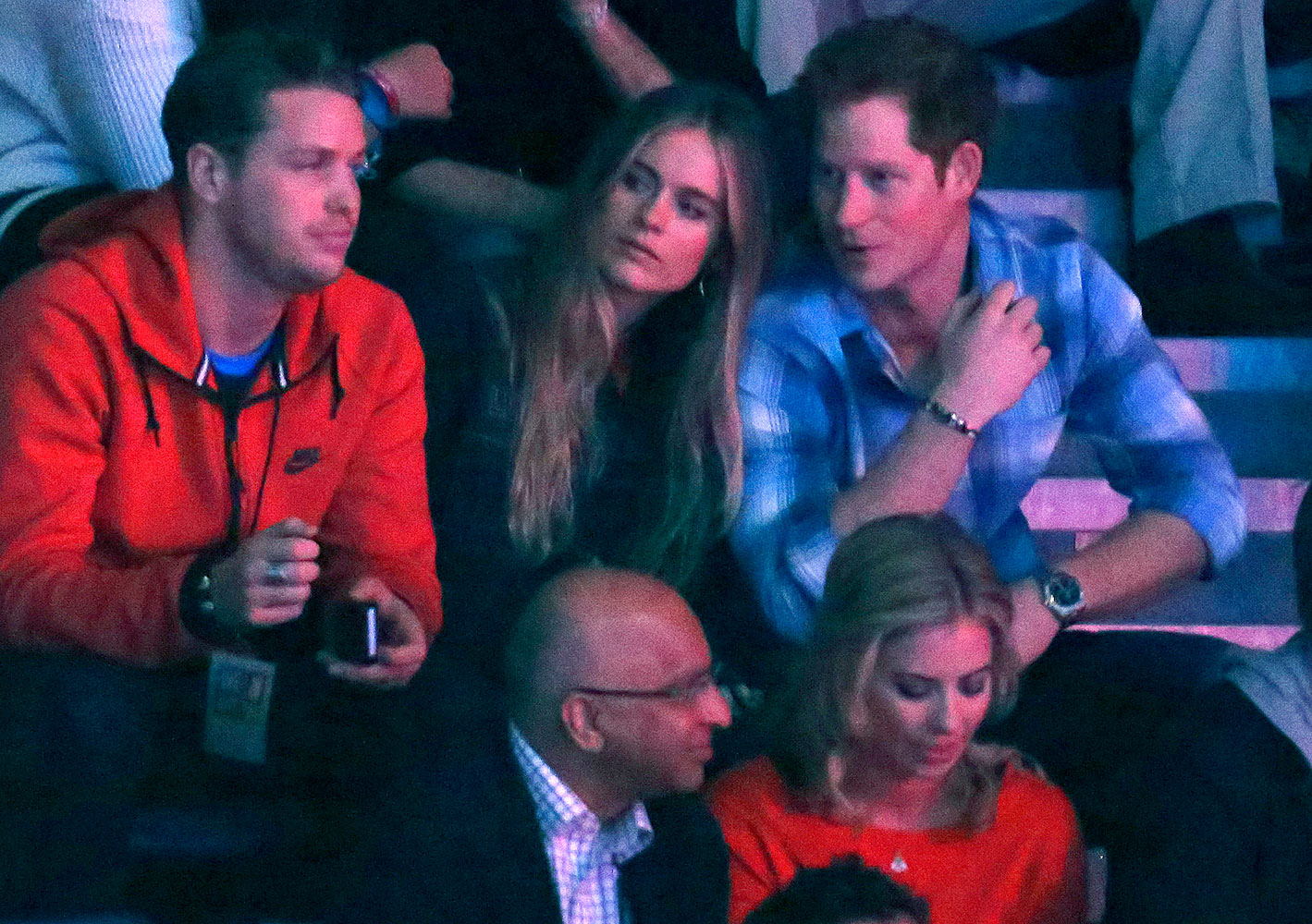 Britain's Prince Harry (R) and Cressida Bonas (2nd R) watch the WE Day UK event at Wembley Arena in London March 7, 2014.  