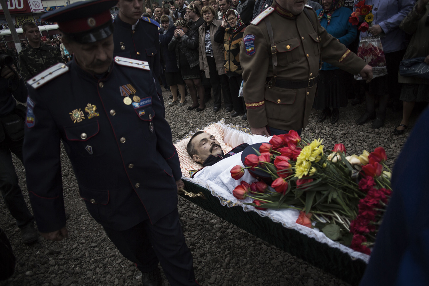 Apr. 20, 2014. The body of Pavel Pavelco, 42, a pro Russia militiaman, one of three people killed last Sunday in a shooting by unknown gunmen at a checkpoint, is carried by pallbearers to a church during a funeral in Slovyansk, Ukraine.