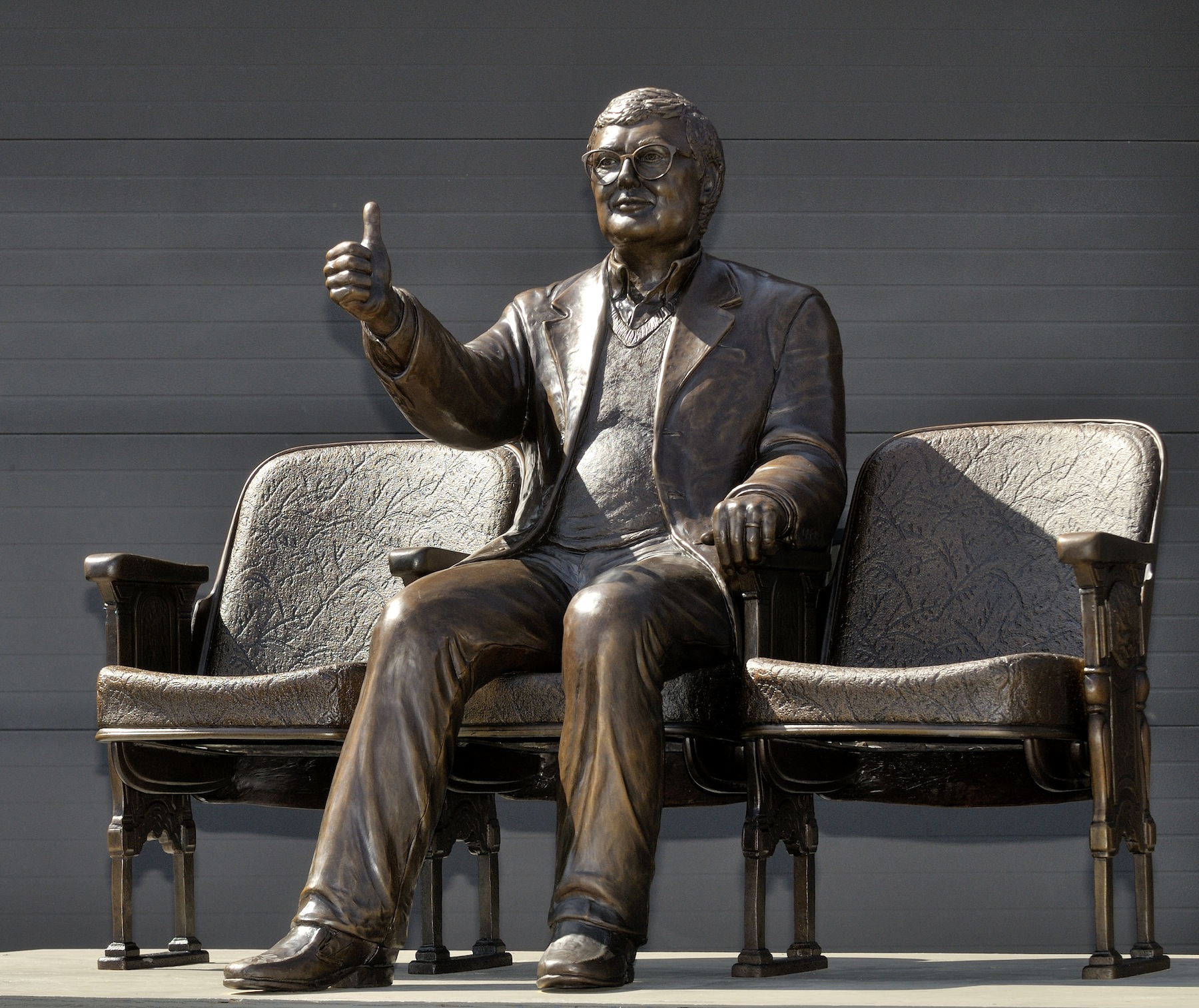 A bronze statue of Pulitzer Prize winning film critic Roger Ebert giving his famous 'thumbs up