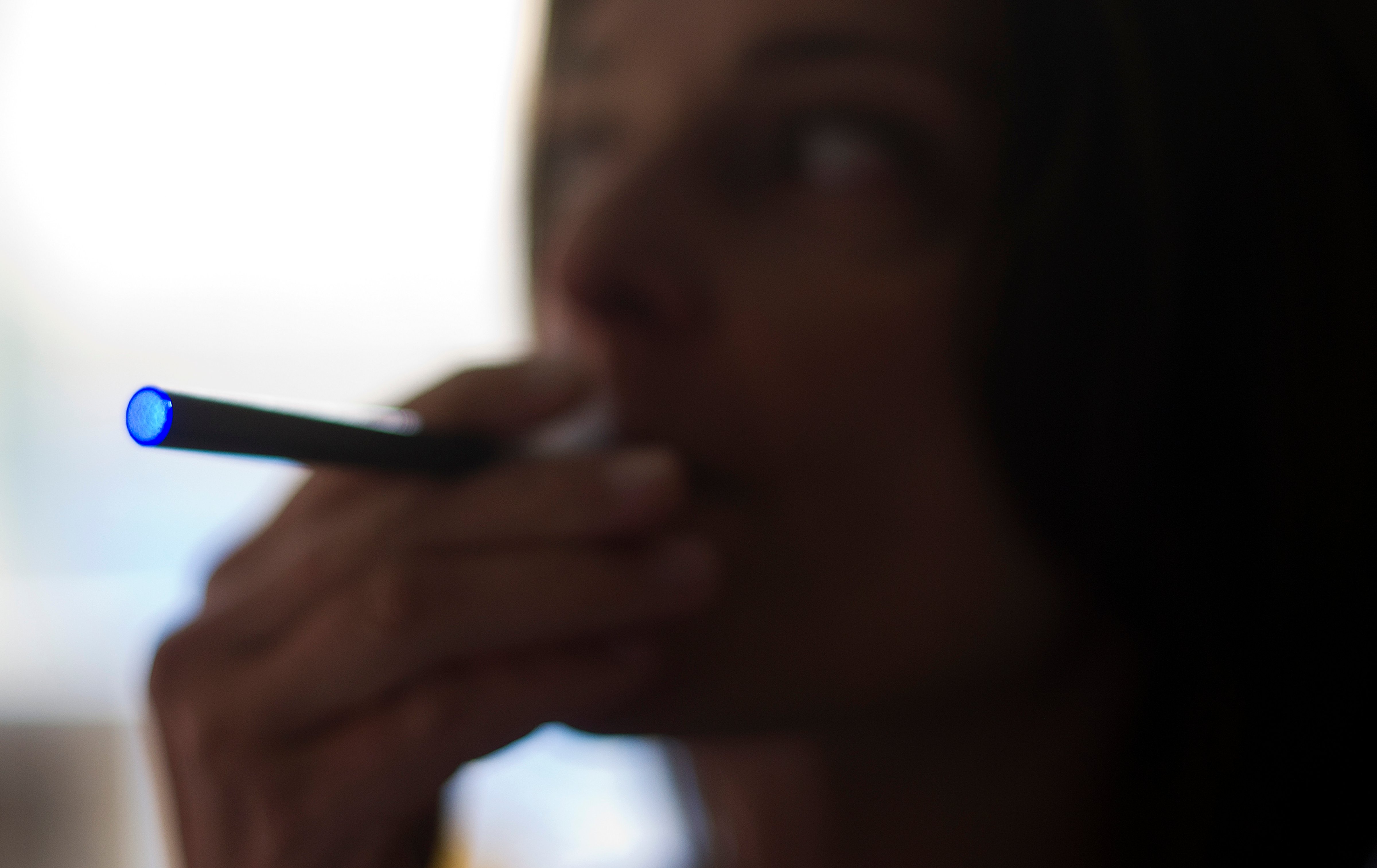 A woman smokes a "Blu" e-cigarette in Washington, D.C., on Sept. 25, 2013.