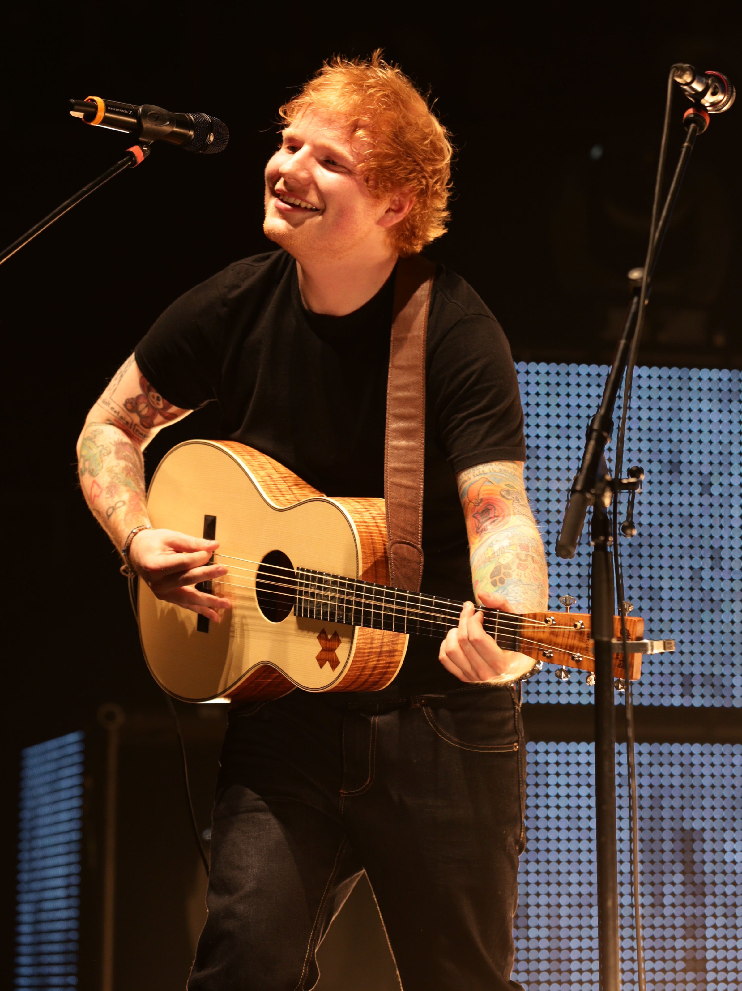 Ed Sheeran performing on stage in London. (Yui Mok—PA Wire/AP)