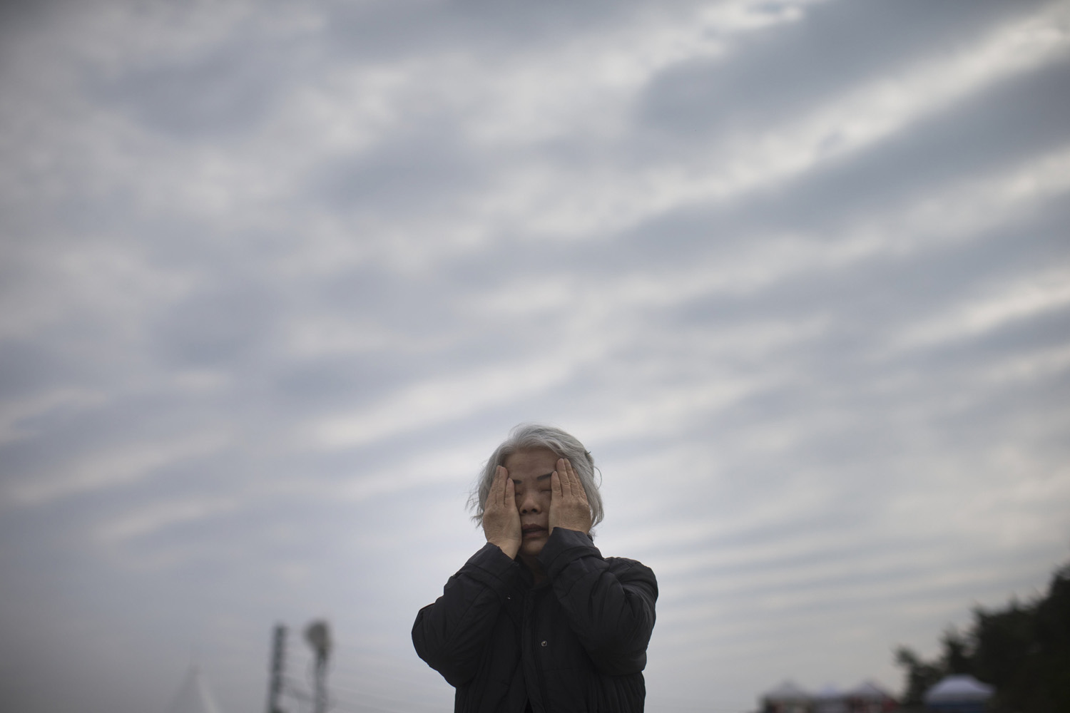 Apr. 22, 2014. A relative of a missing passenger from the sunken Sewol ferry weeps by the sea in Jindo, South Korea.