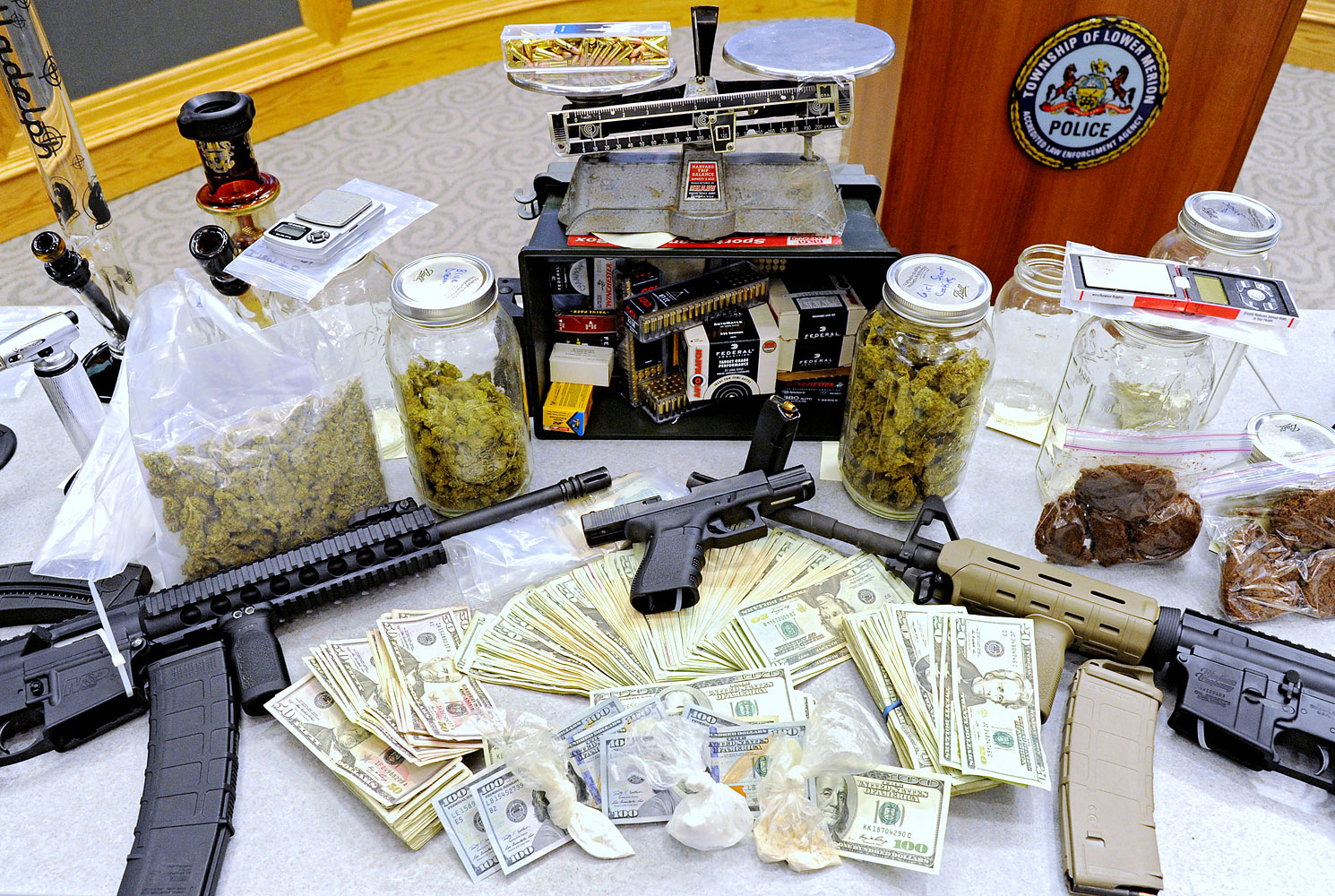 Drugs, guns and other illegal items were seized when Lower Merion Police broke up a drug-distribution ring in Montgomery County, Pa. (Clem Murray—The Philadelphia Inquirer/AP)