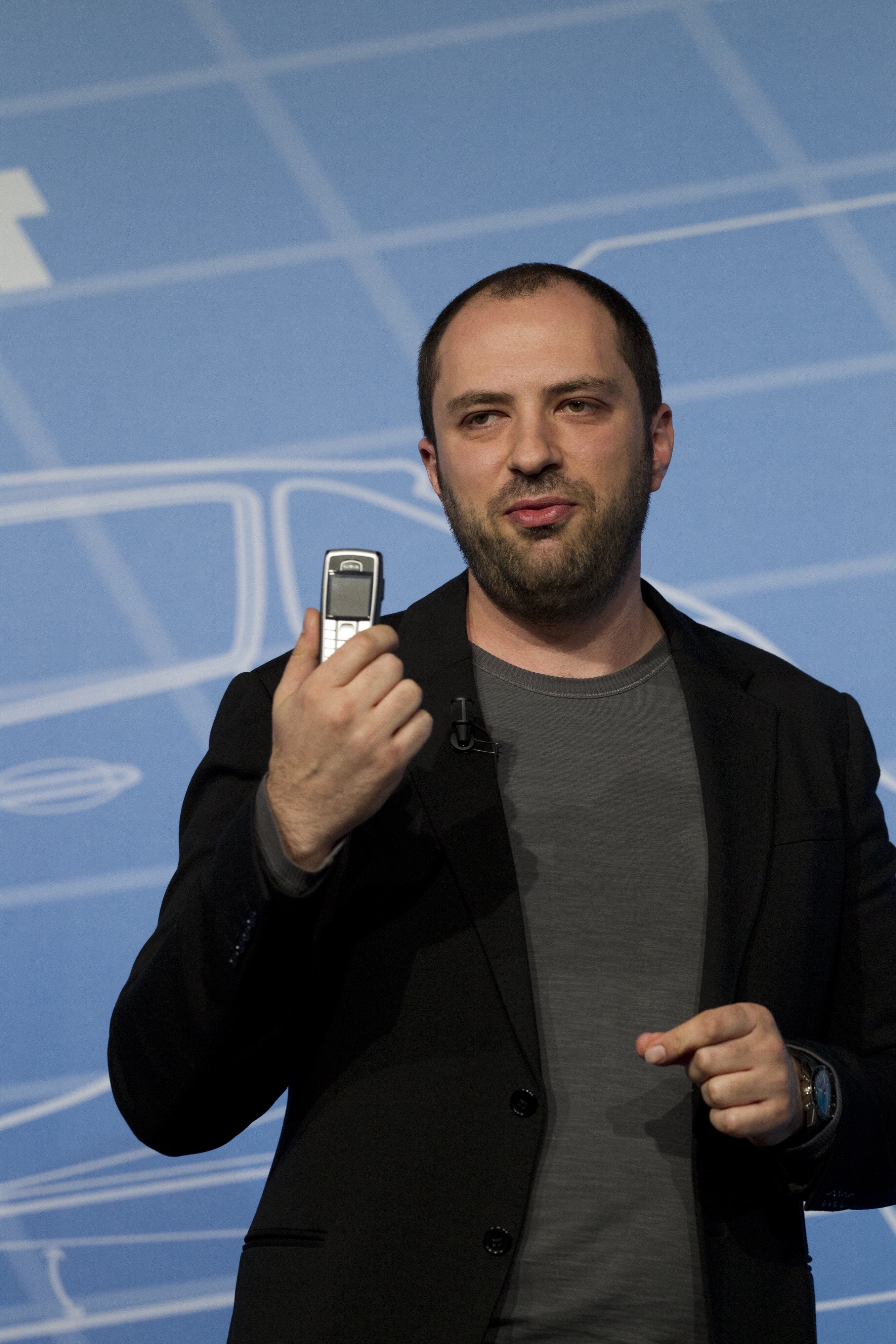 WhatsApp CEO Jan Koum shows off his personal phone at Mobile World Congress in Barcelona on February 24, 2014 (Angel Navarette / Bloomberg / Getty Images)