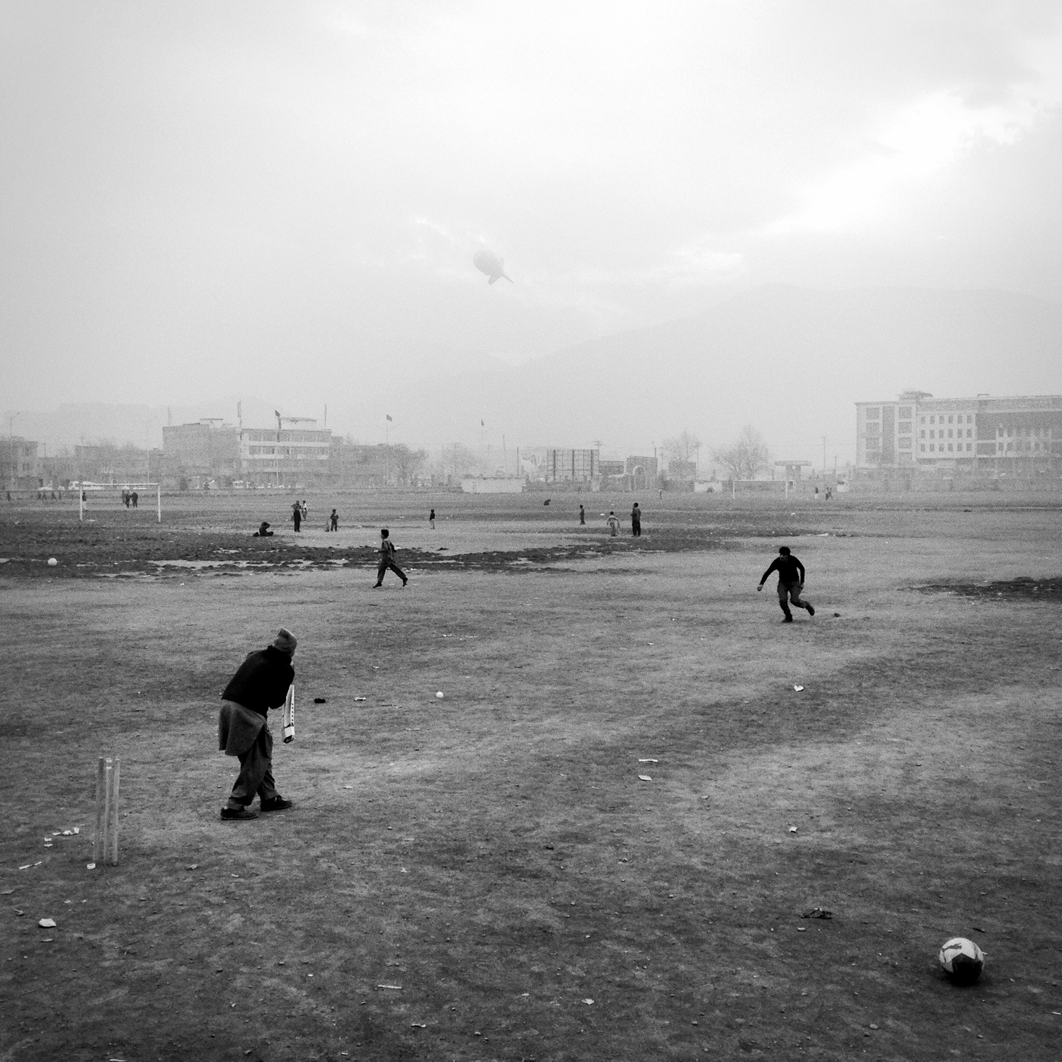 Sement Khana, Kabul, Afghanistan#Cricket in #Kabul. Under the watchful eye of Uncle Sam Cam above.