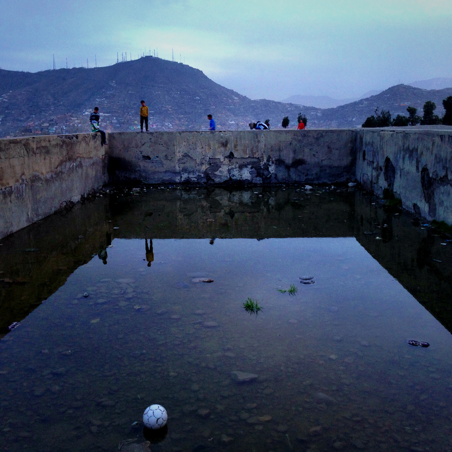 Shamsi Plaza, Kabul, Afghanistan
                              Soccer field turned swimming pool. 4.9.2014.