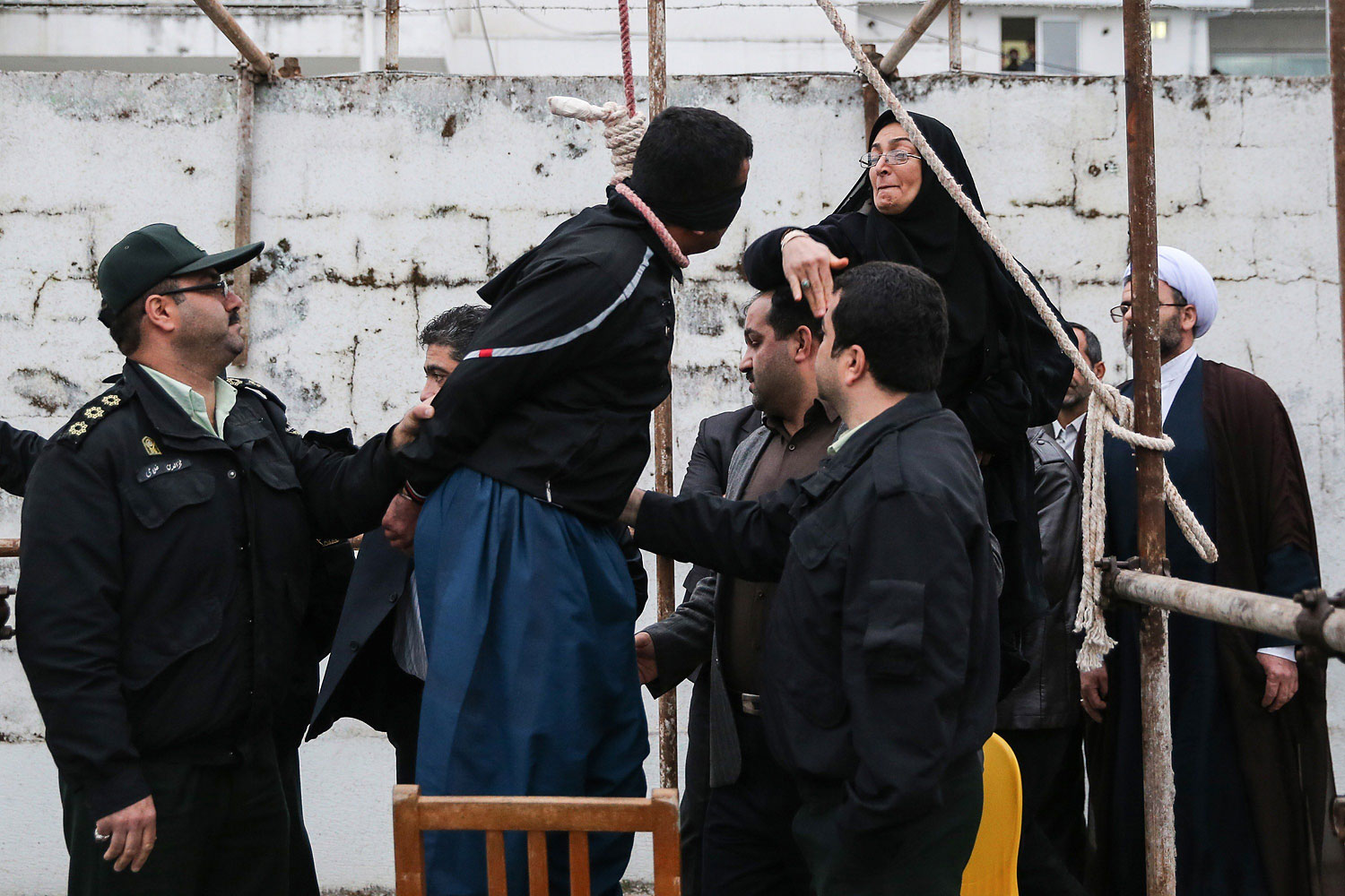 The mother of Abdolah Hosseinzadeh, who was murdered in 2007, slaps Balal who killed her son during the execution ceremony in the northern city of Nowshahr on April 15, 2014 just before she removed the noose around his neck with the help of her husband, sparing the life of her son's convicted murderer.