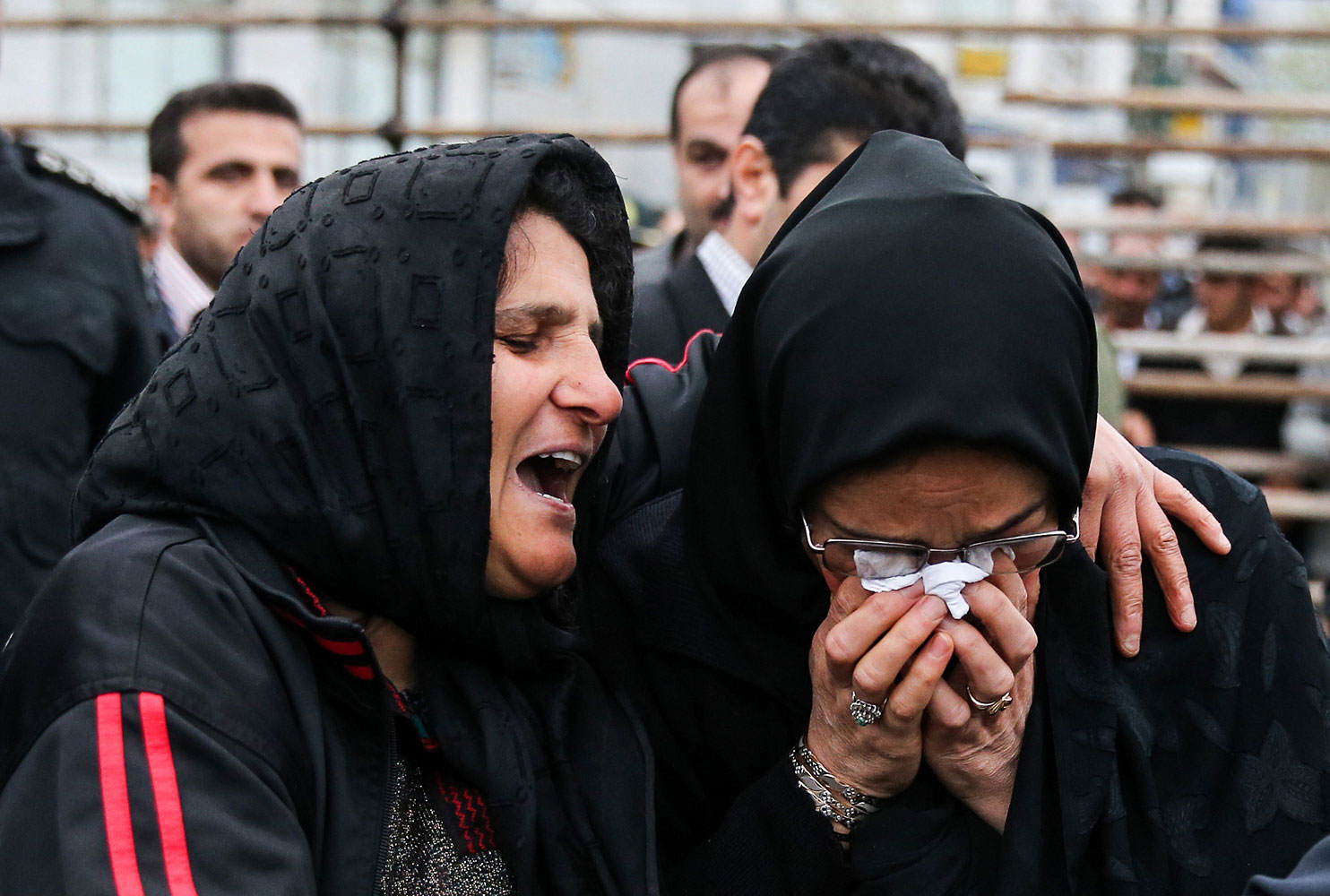 The mother of Balal cries with the mother of Abdolah Hosseinzadeh after she forgave Balal, giving him an emotional slap prior to removing the noose around his neck in the gallows during his execution ceremony in the northern city of Nowshahr on April 15, 2014.