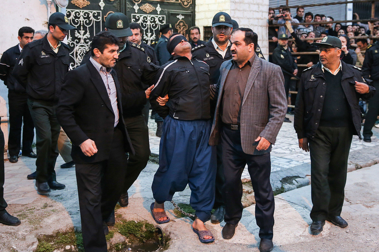 Balal, who killed an Iranian youth Abdolah Hosseinzadeh in a street fight with a knife in 2007, is brought to the gallows by judicial officals during his execution ceremony in the northern city of Nowshahr on April 15, 2014.