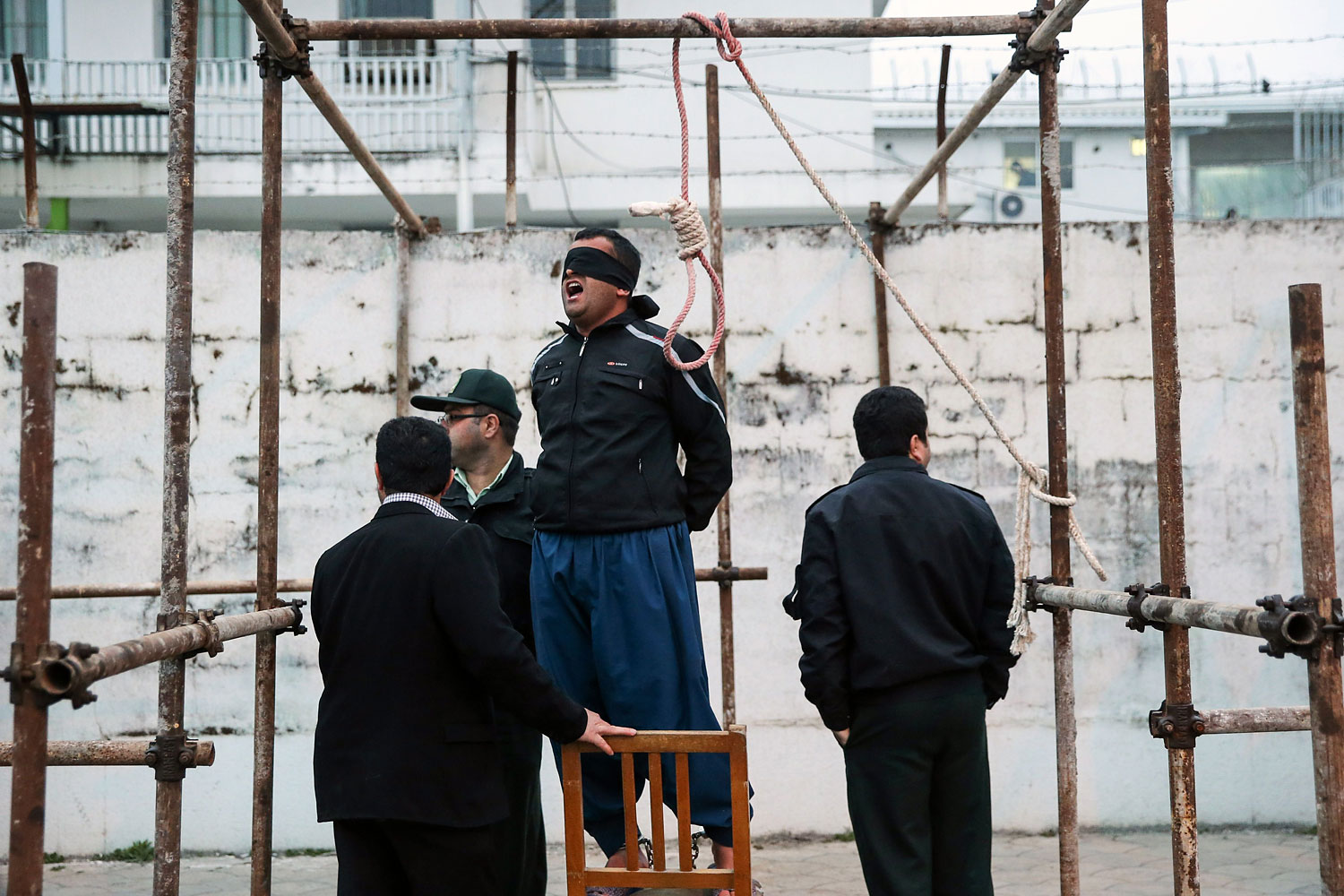 Balal reacts as he stands in the gallows during his execution ceremony in the northern city of Nowshahr on April 15, 2014.