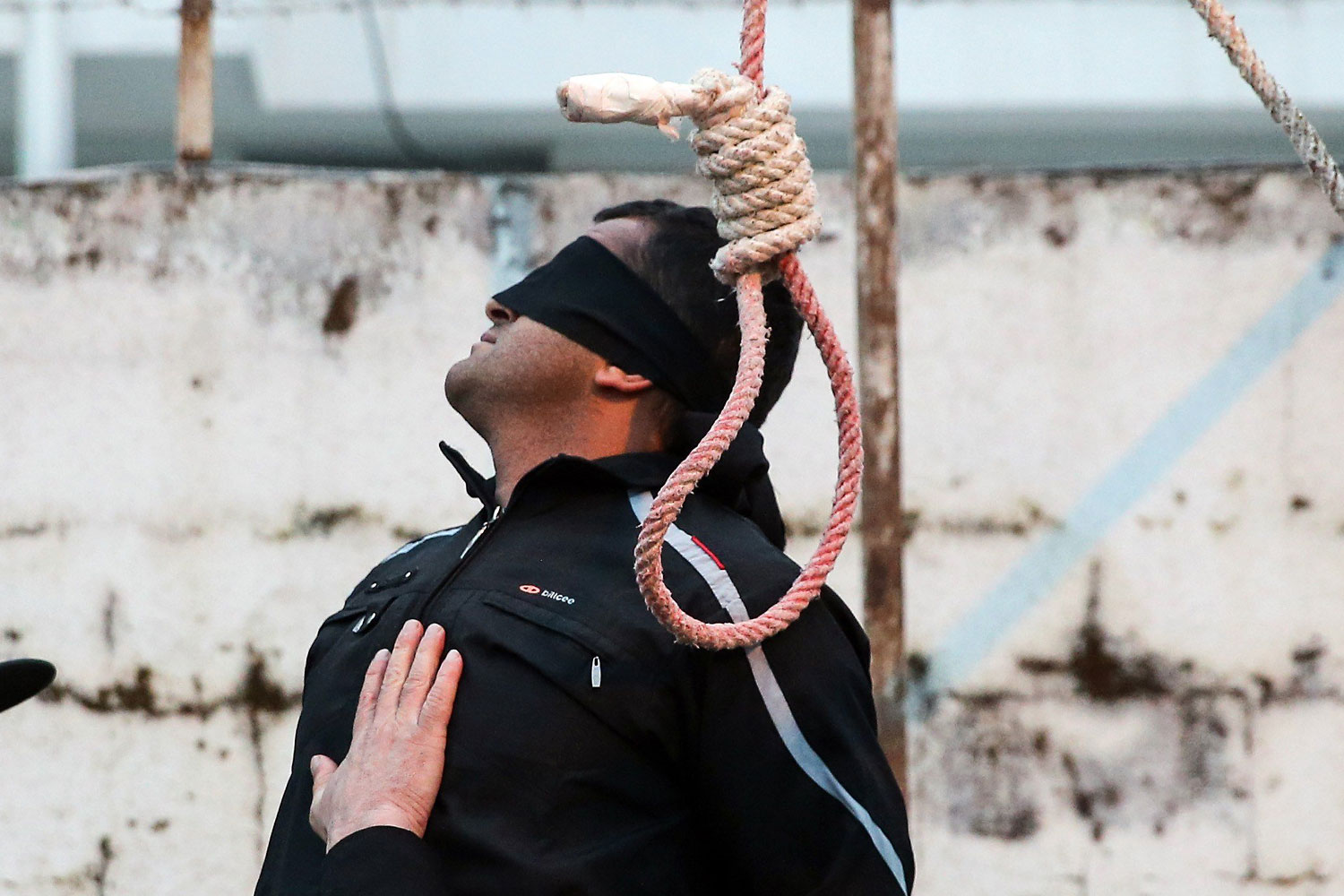 Balal is pictured blindfolded next to a noose during his execution ceremony in the northern city of Nowshahr on April 15, 2014.