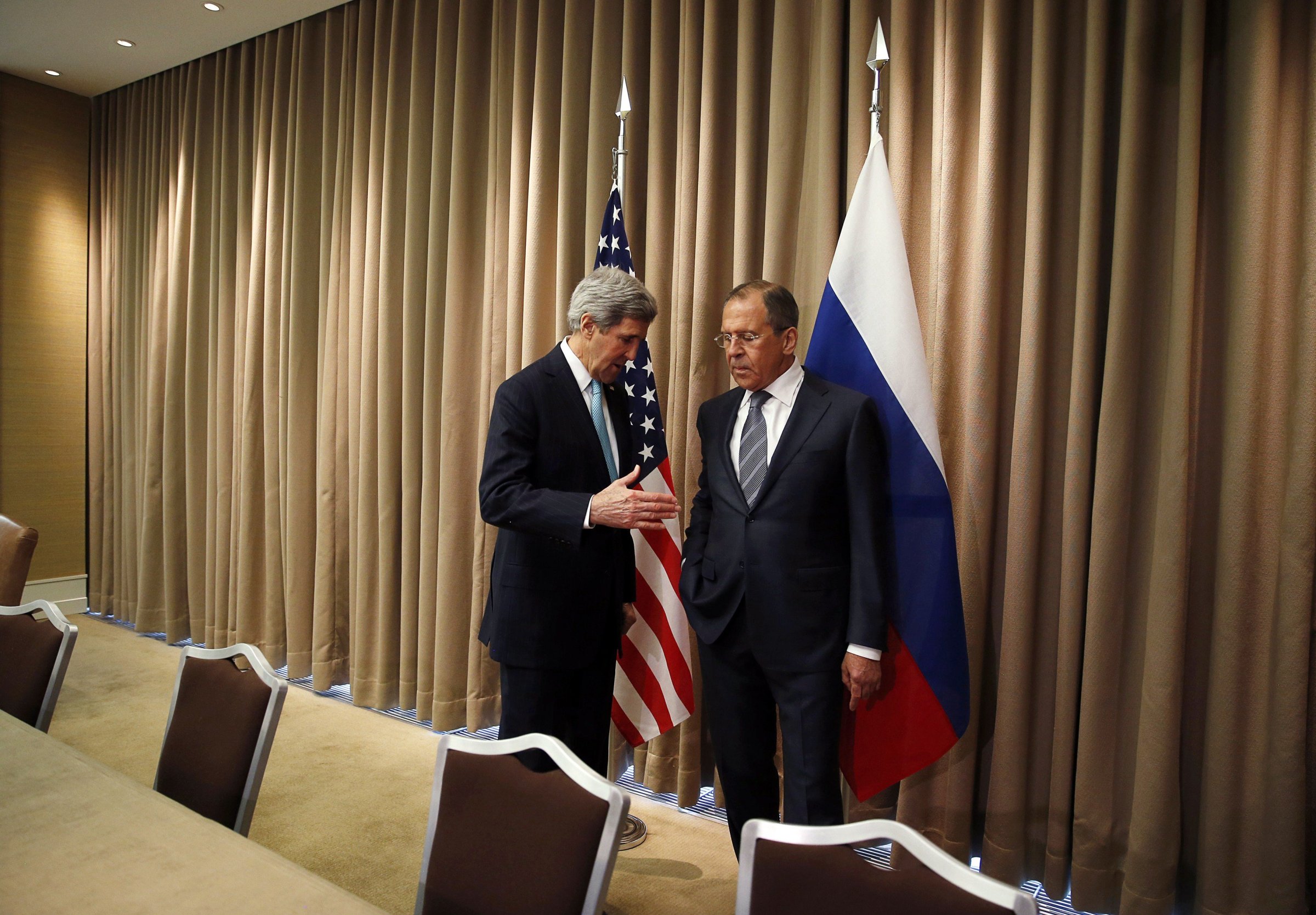 From left: U.S. Secretary of State John Kerry talks with Russian Foreign minister Sergei Lavrov at the start of a bilateral meeting to discuss the ongoing situation in Ukraine on April 17, 2014 in Geneva.