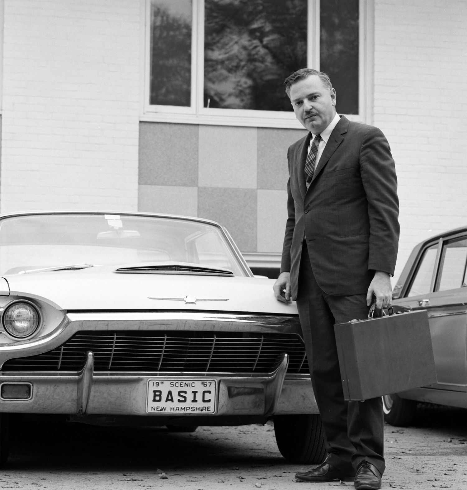 John Kemeny shows off his vanity license plate in 1967 (Adrian N. Bouchard / Dartmouth College)