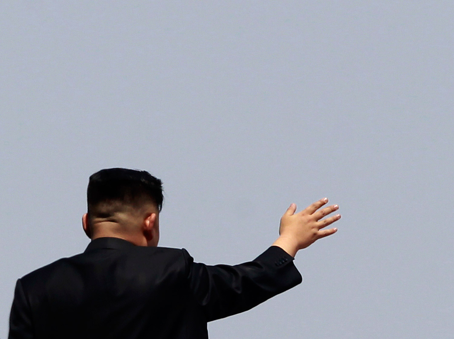 North Korea leader Kim Jong-un waves to the crowd during a military parade to celebrate the centenary of the birth of North Korea founder Kim Il-sung in Pyongyang