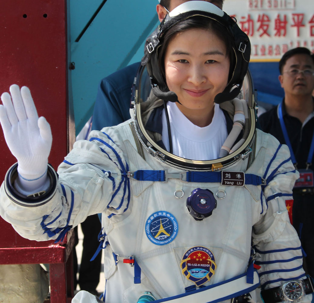 Chinese astronaut Liu Yang waves as she attends a drill in Jiuquan, northwest China's Gansu Province, on July 27, 2012. On June 16, 2012, Yang became China's first woman in space.