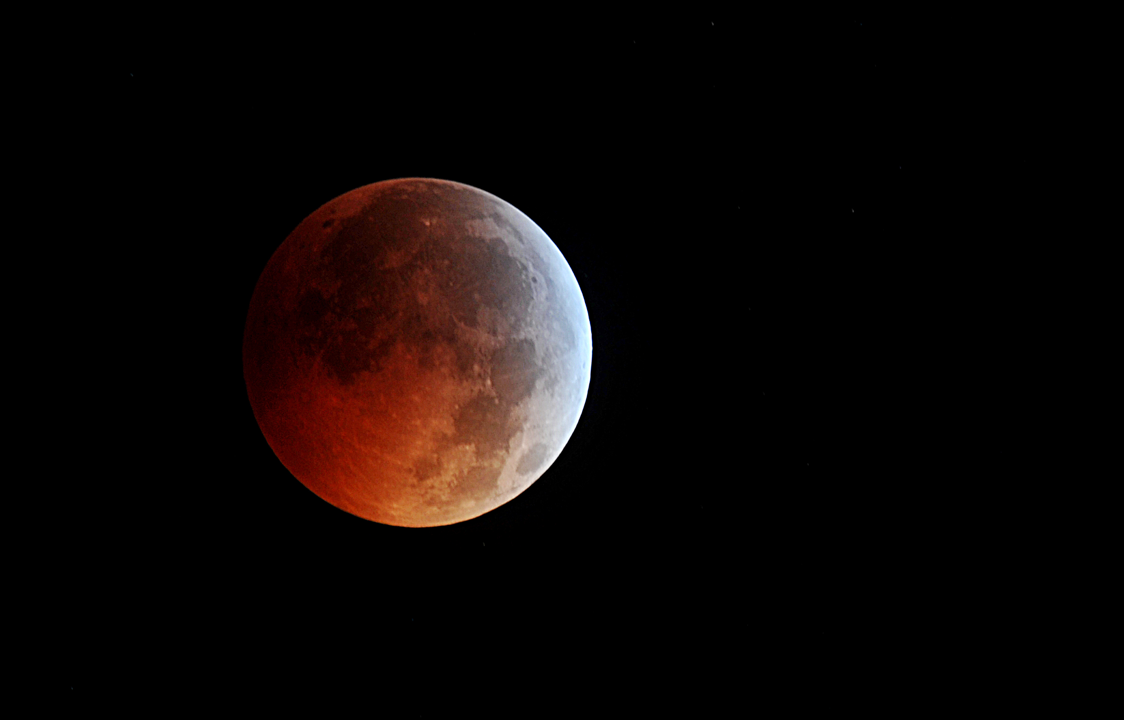 Lights out: a blood moon as a total lunar eclipse reaches its peak