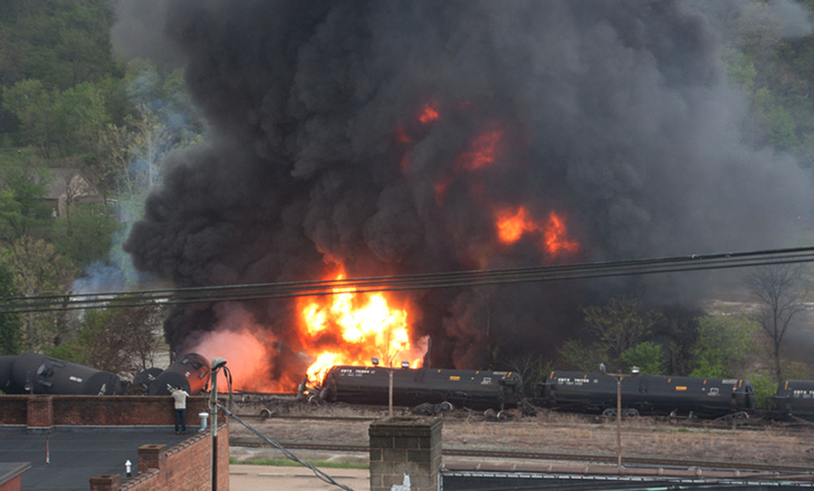 This image made available by the City of Lynchburg shows several CSX tanker cars carrying crude oil in flames after derailing in downtown Lynchburg, Va., on April 30, 2014. (LuAnn Hunt—City of Lynchburg/AP)