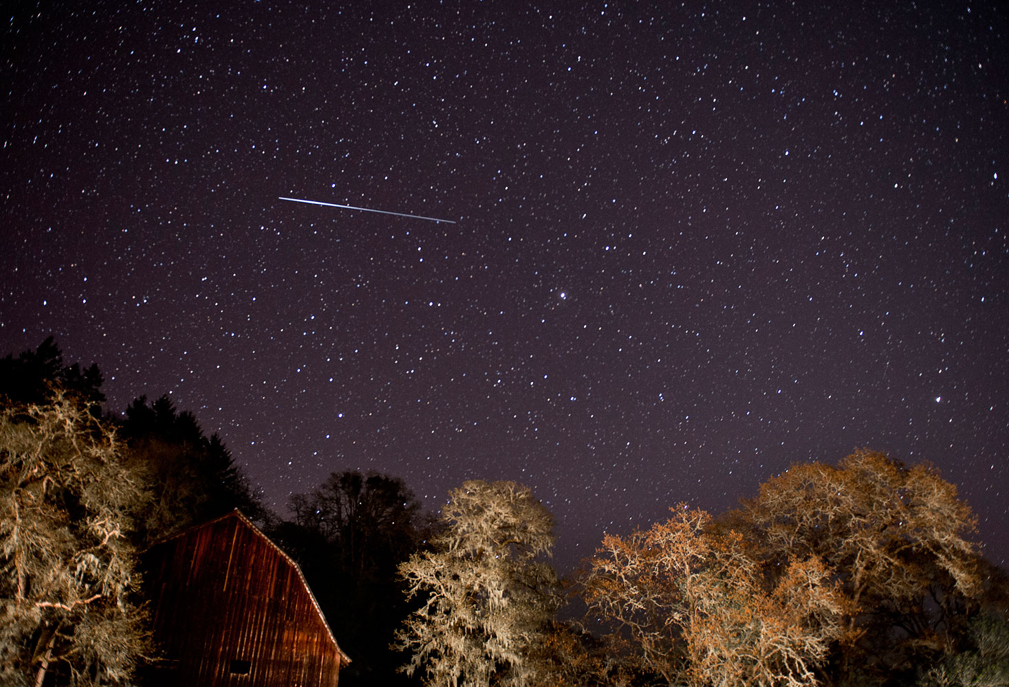 A meteor from the Lyrid meteor shower streaks through the sky above a barn along a country road near Oakland, Ore. April 21, 2012. (Robin Loznak&amp;mdash;Zuma Press/Corbis)
