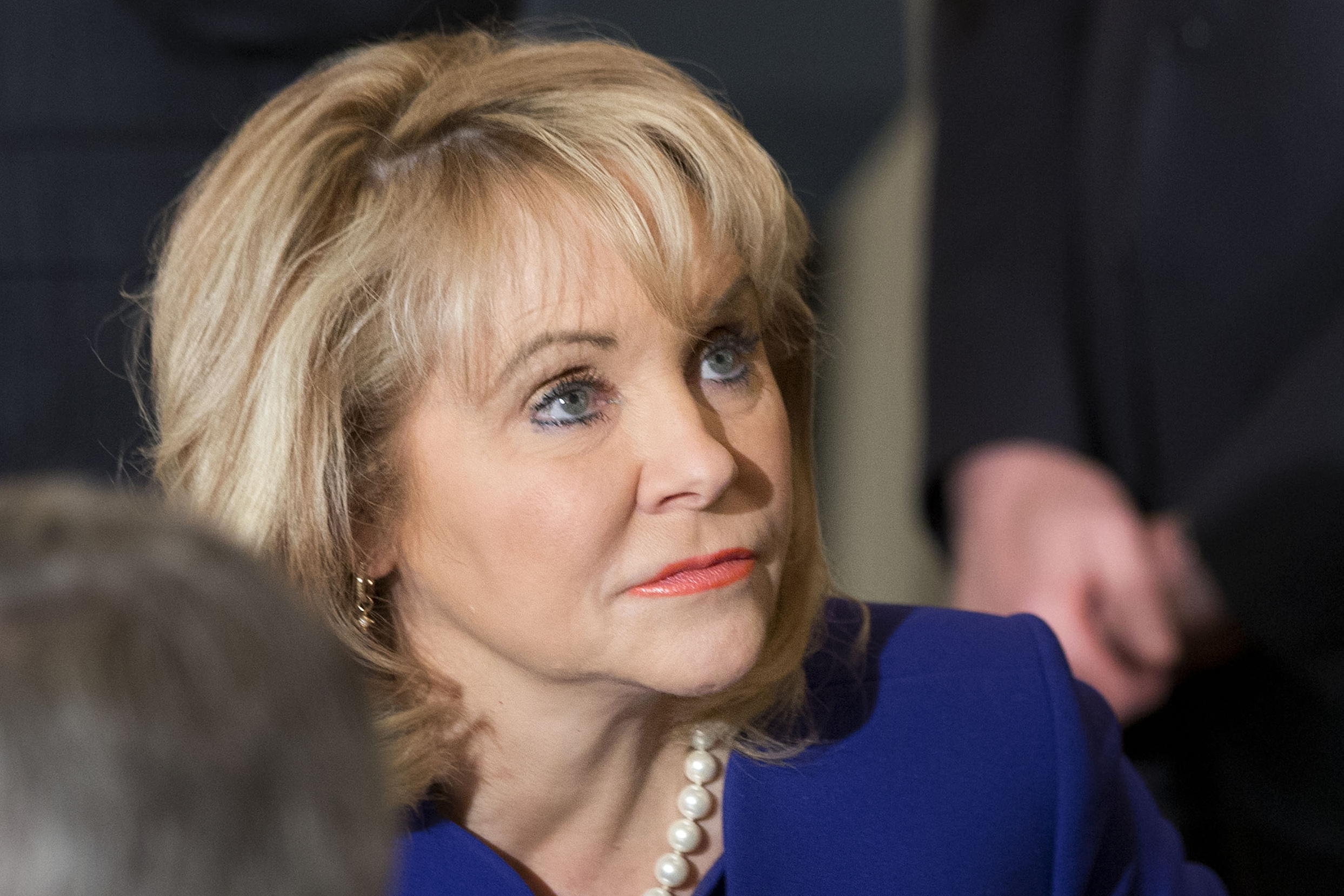 Oklahoma Governor Mary Fallin, chair of the National Governors Association, waits for the arrival of President Barack Obama to speak to members of the National Governors Association at the White House on Feb. 24, 2014 (Jacquelyn Martin—AP)