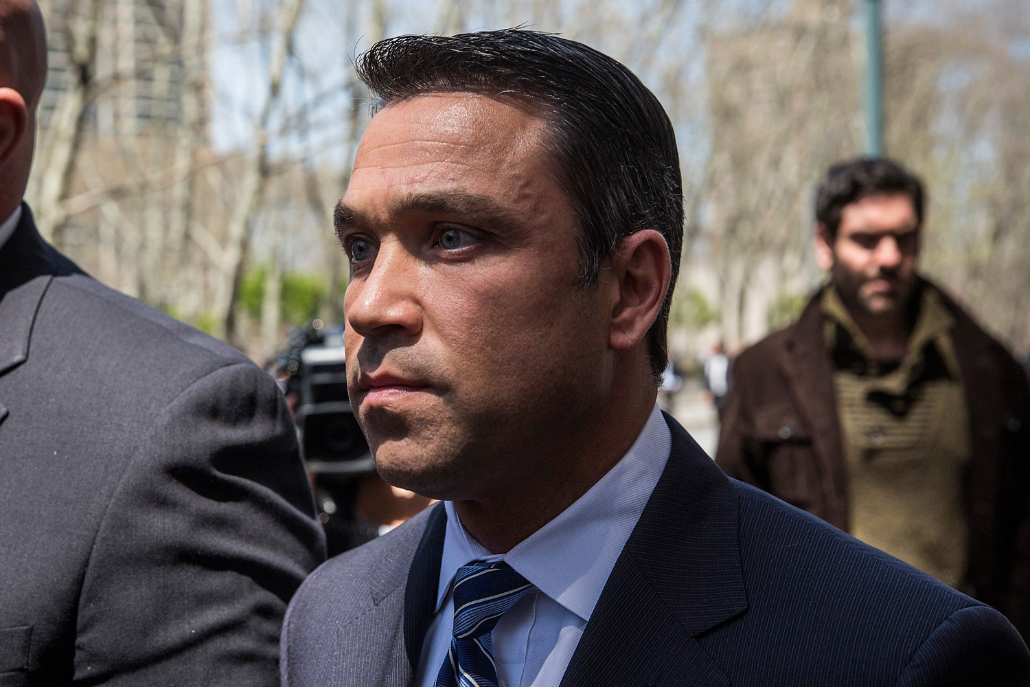 Representative Michael Grimm walks out of Brooklyn Federal Court after being indicted on 20 counts on April 28, 2014 in New York. (Andrew Burton—Getty Images)