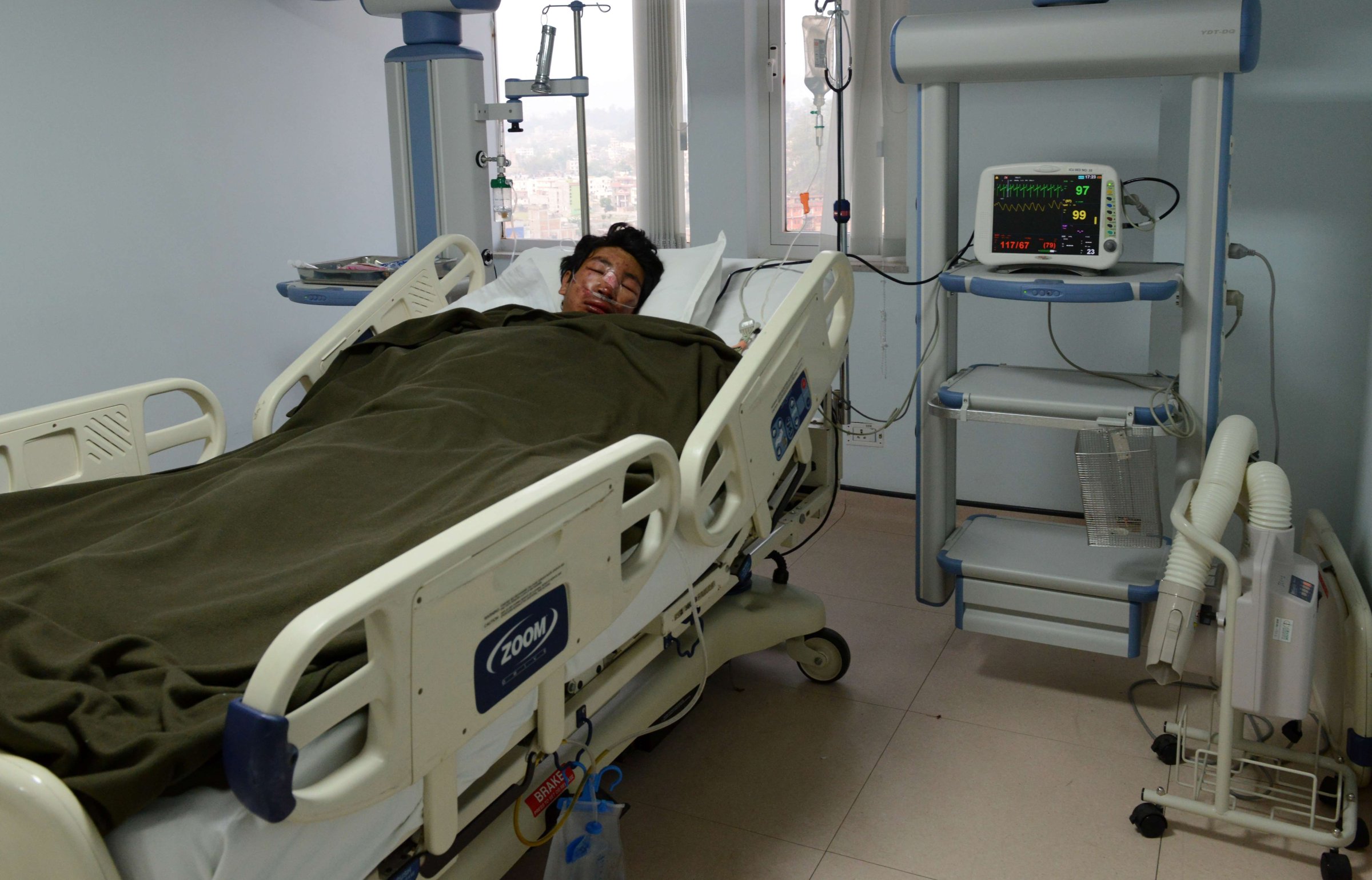 Nepalese mountaineer, Dawa Tashi Sherpa, survivor of the avalanche on Mount Everest, lies in the Intensive Care Unit (ICU) at Grandi International Hospital in Kathmandu on April 18, 2014.