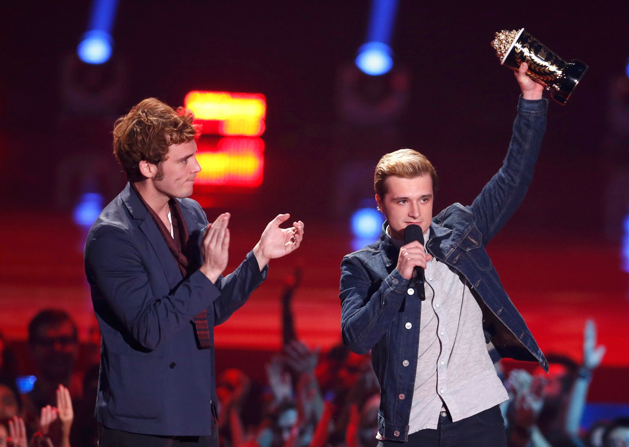 From left: Sam Claflin and Josh Hutcherson accept the award for Best Movie of the Year for "The Hunger Games: Catching Fire" at the 2014 MTV Movie Awards in Los Angeles, on April 13, 2014.