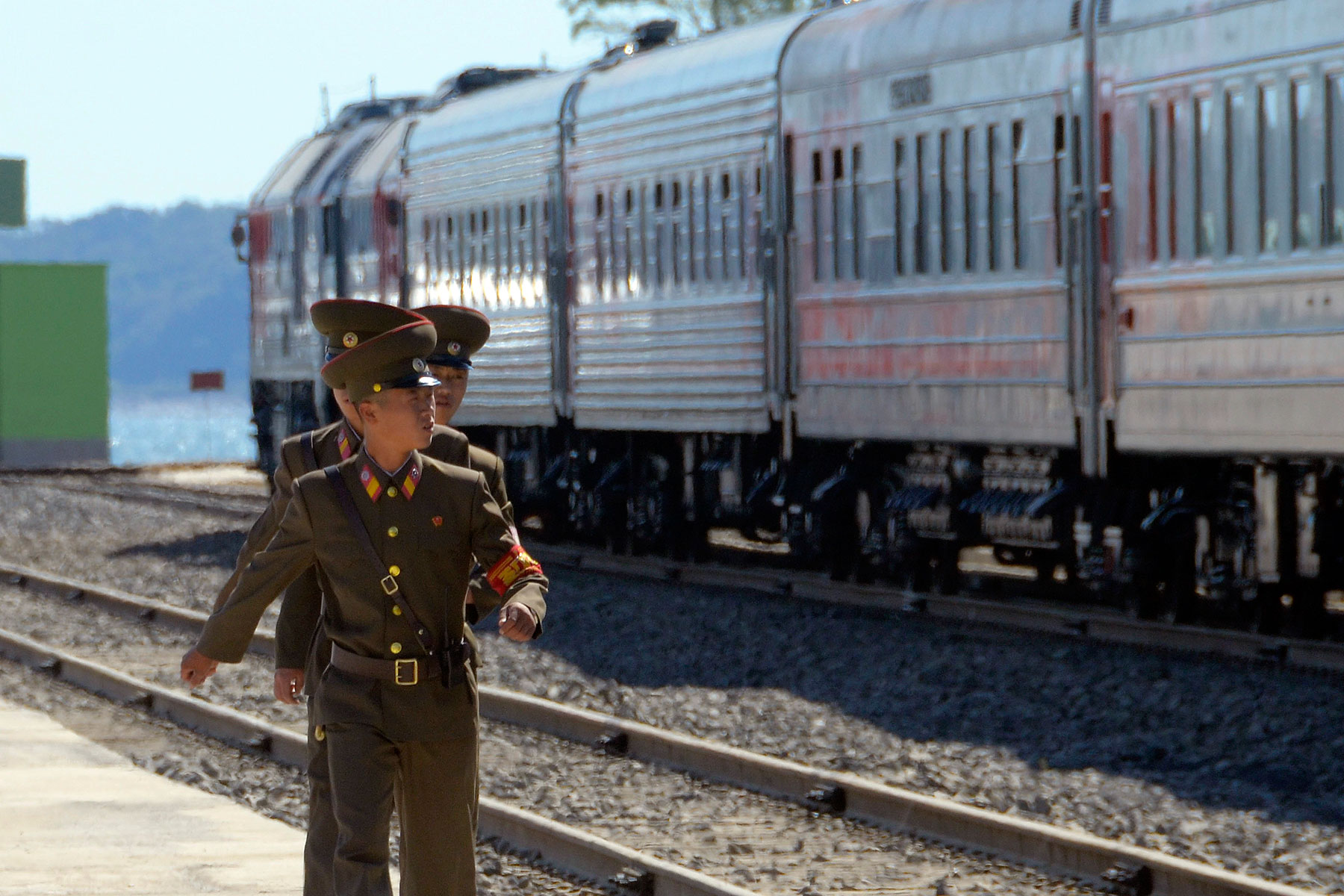 North Korean soldiers march near trains after a ceremony to mark the re-opening of a railway link between Russia and North Korea at the port of Rajin Sept. 22, 2013 (Yuri Maltsev—Reuters)
