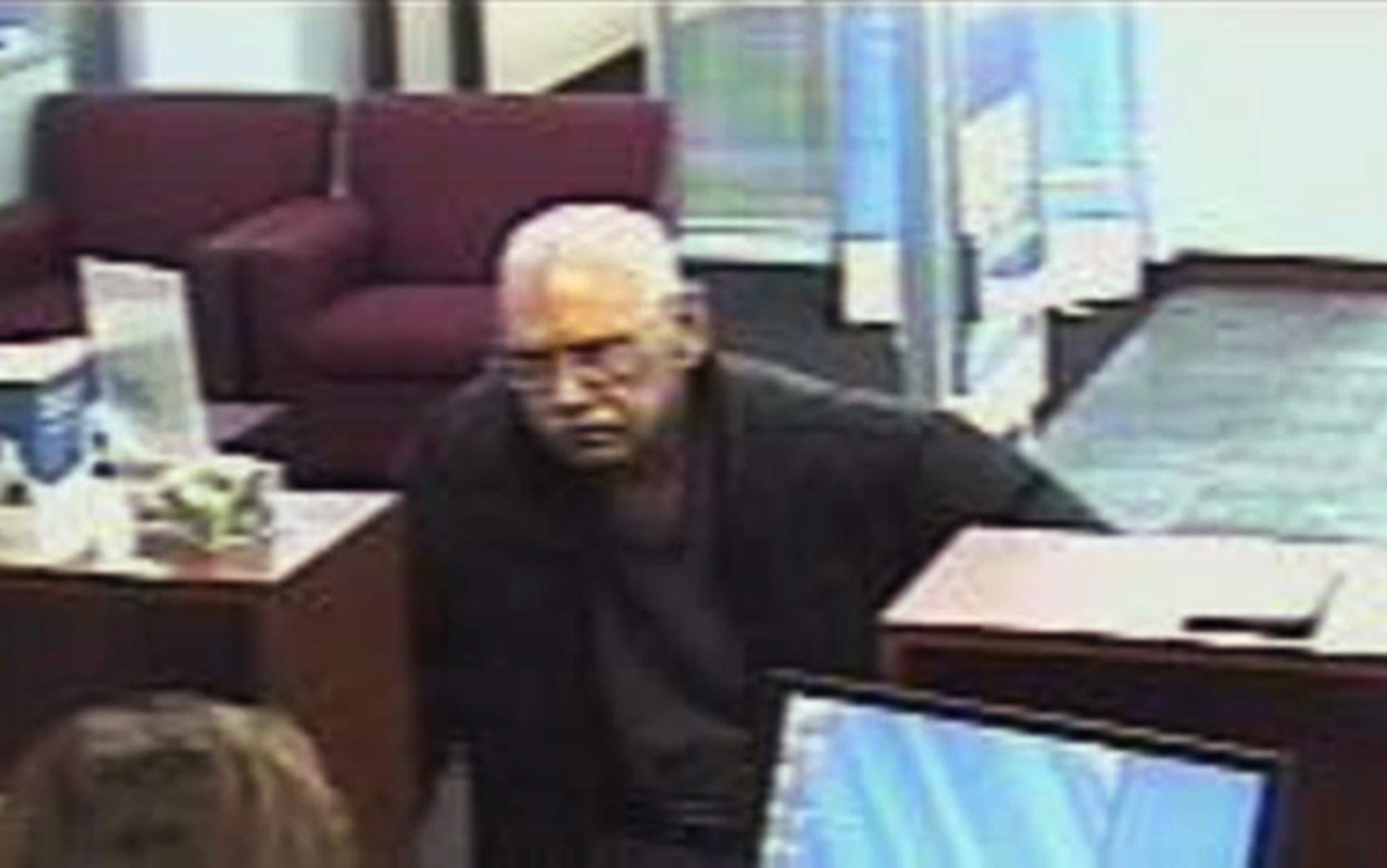 This Feb. 9, 2013 file surveillance photo provided by the FBI shows 73-year-old Walter Unbehaun, an ex-convict from Rock Hill., S.C., during a bank robbery in Niles, Ill. Unbehaun allegedly told investigators he intended to get caught so he could live his final years behind bars. (FBI/AP)
