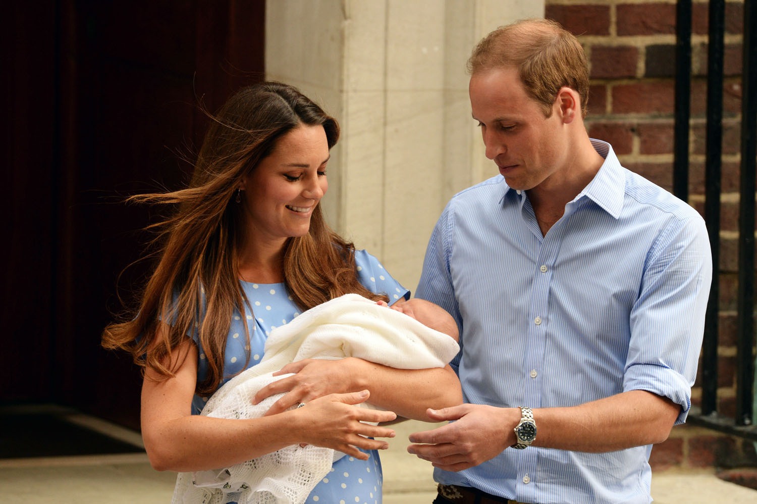 Prince William, Duke of Cambridge and Catherine, Duchess of Cambridge, depart The Lindo Wing with their newborn son, Prince George, at St Mary's Hospital in London on July 23, 2013.