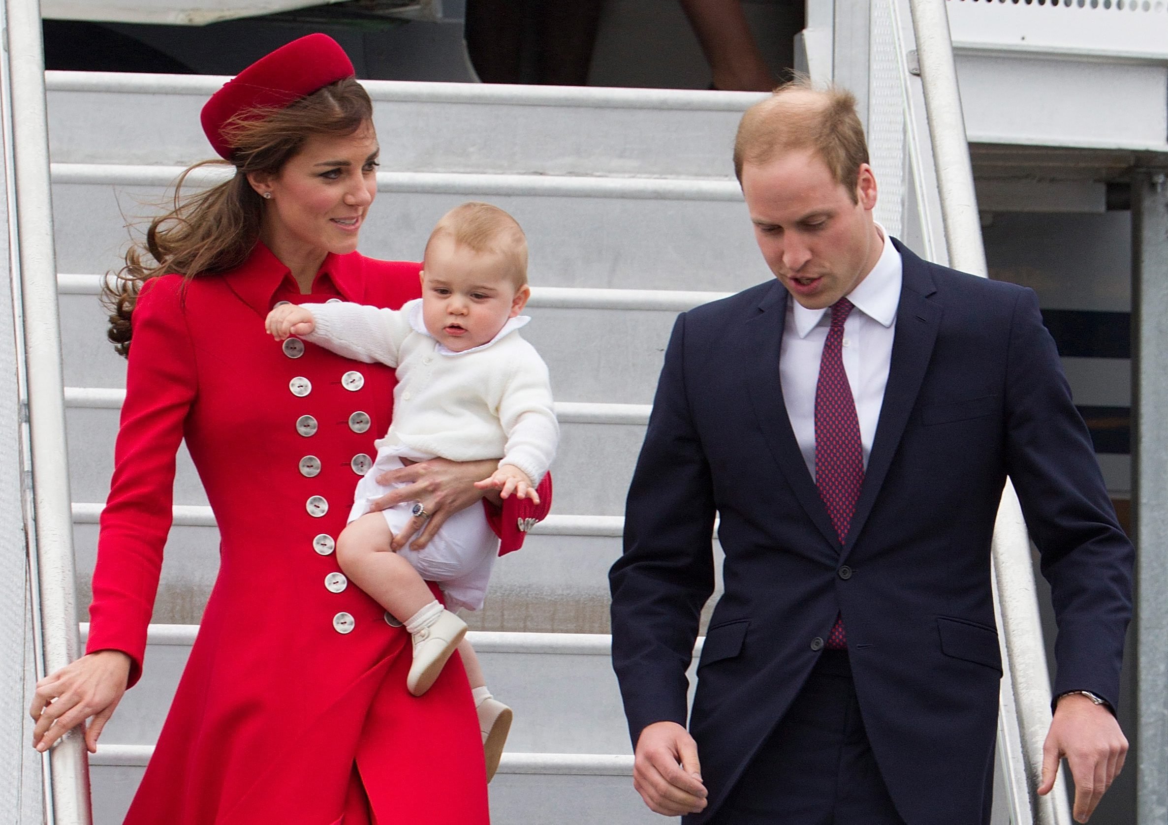 From right: Britain's Prince William, Duke of Cambridge and his wife Catherine, Duchess of Cambridge, carrying baby Prince George, arrive at Wellington Military Terminal, in Wellington, New Zealand, on April 7, 2014. (EPA)