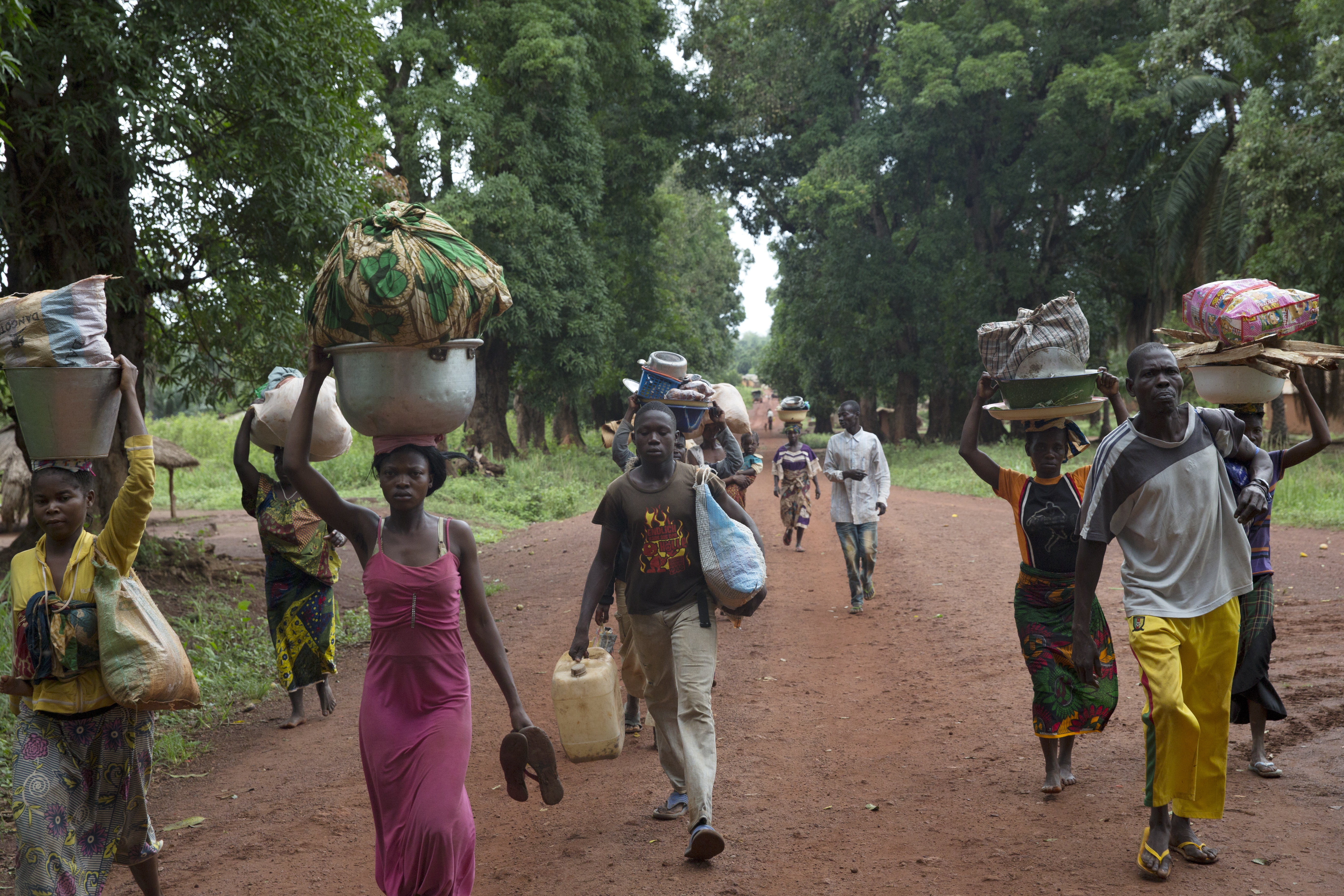 Apr. 15, 2014. Christians who have taken refuge from fighting between ex-Séléka and anti-balaka at the Catholic mission went back to their homes to get belongings during a break in the clashes.