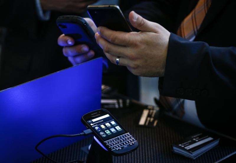 A Blackberry Q10 handset is seen on display as people use their devices at the Fairfax Holdings annual general meeting for shareholders in Toronto