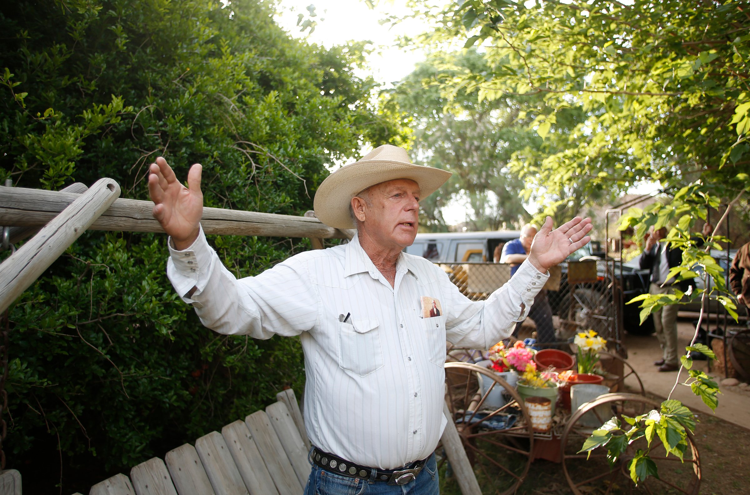 Rancher Cliven Bundy gestures at his home in Bunkerville