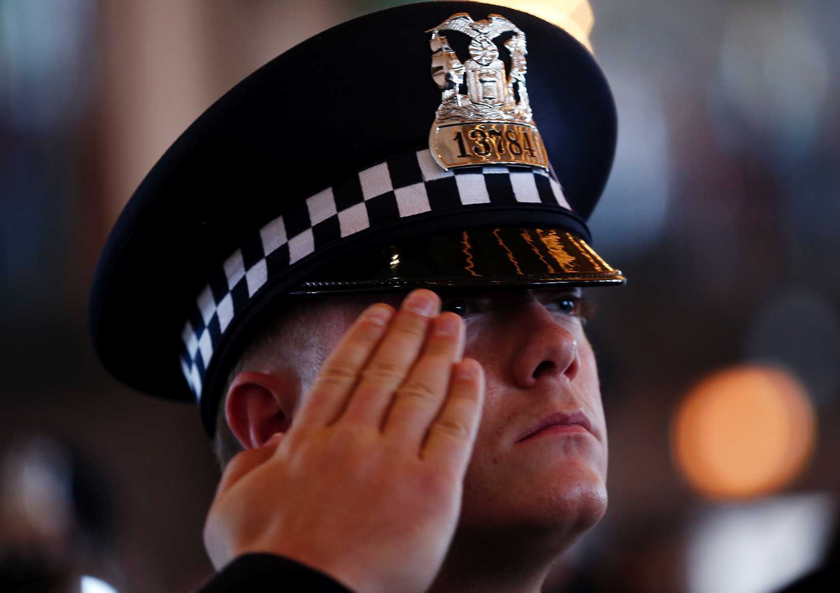 A Chicago Police Department recruit salutes during a graduation ceremony in Chicago, Illinois, April 21, 2014. (Jim Young—Reuters)