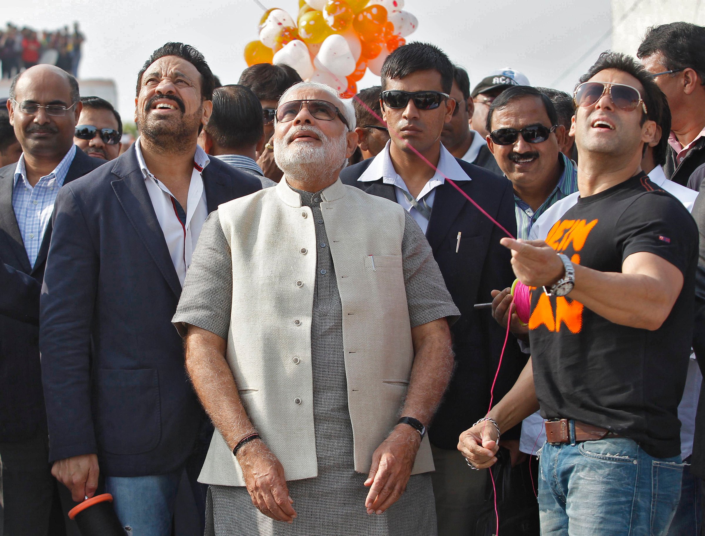 Bollywood actor Khan flies a kite as Hindu nationalist Modi watches during a kite flying festival in Ahmedabad