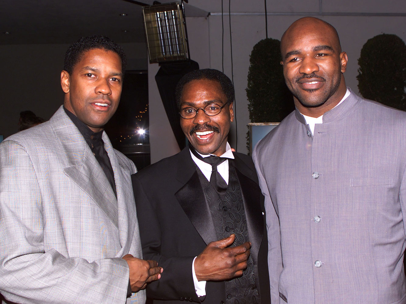 From left, Denzel Wahington, Rubin Carter, and Evander Holyfield  at the premier of The Hurricane, a film starring Denzel Washington on the life of Rubin Carter, Dec. 14 1999 in Los Angeles.