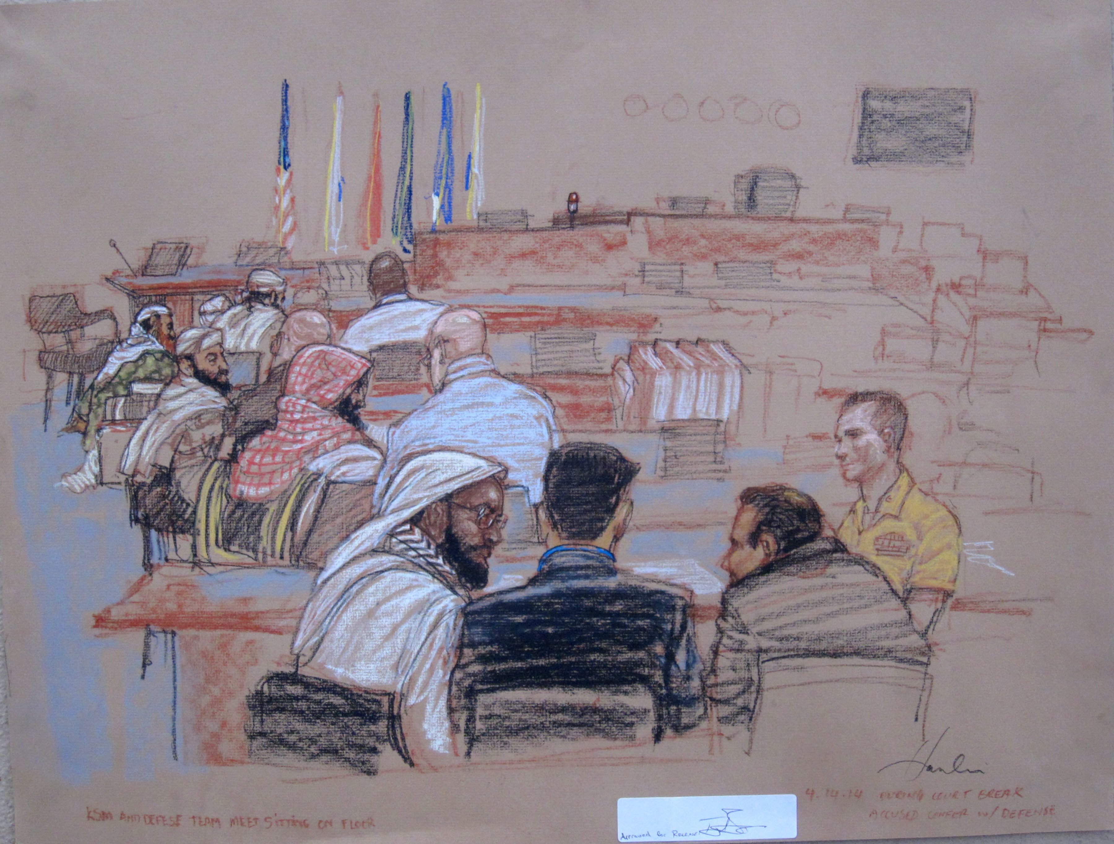 The 9/11 accused confer with their defense lawyers during a break in pretrial hearings at the U.S. Navy base Guantanamo Bay, Cuba, on April 14, 2014. (Janet Hamlin—EPA)