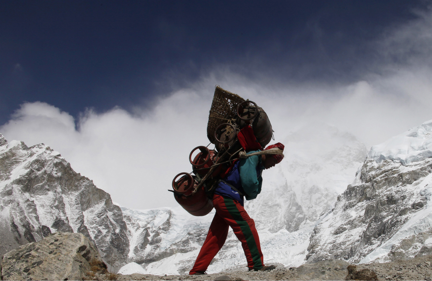 A Nepalese porter walks with his load from Everest base camp in Nepal