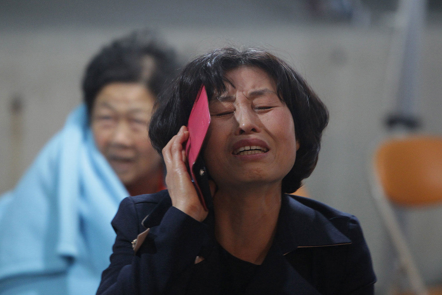 A Woman cries at Jindo port on April 16, 2014 in Jindo-gun, South Korea.