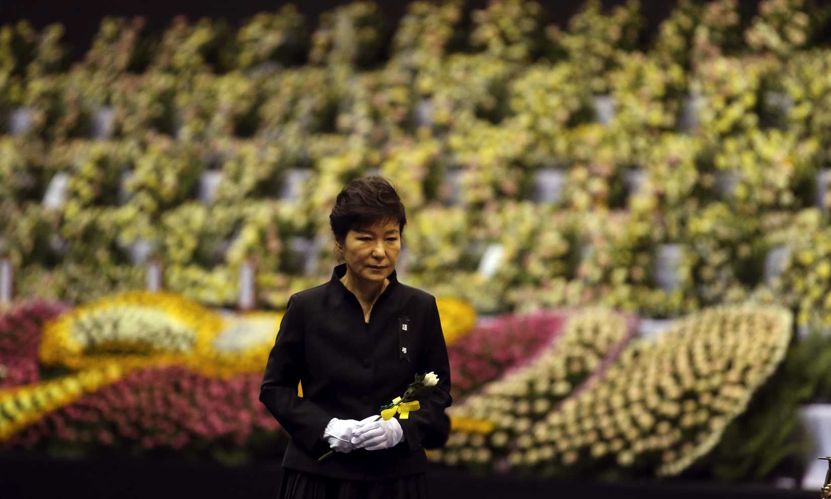 South Korean President Park Geun-hye pays tribute to the victims of the sunken ferry Sewol at a group memorial altar in Ansan, south of Seoul, on Tuesday, April 29, 2014 (Yonhap—AP Photo)