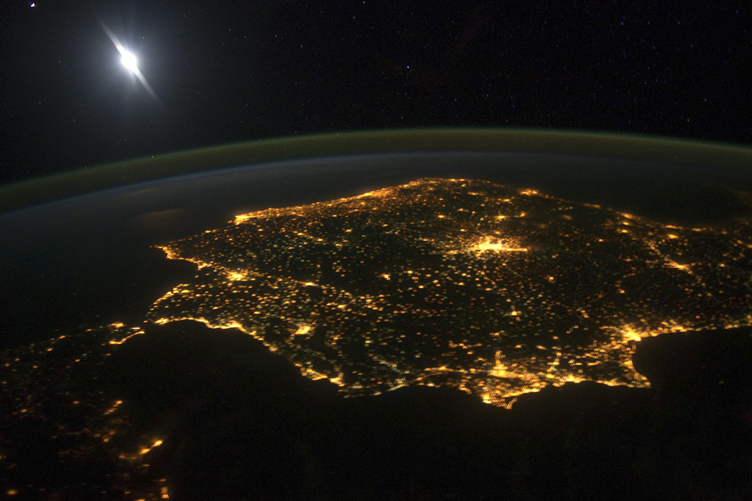 This image released on March 7, 2014 and taken from the International Space Station (ISS) shows the Iberian Peninsula including Spain and Portugal at night. The lights from human settlements reveal where the major towns and activity are. The large mass of light in the middle is Madrid, Spain.