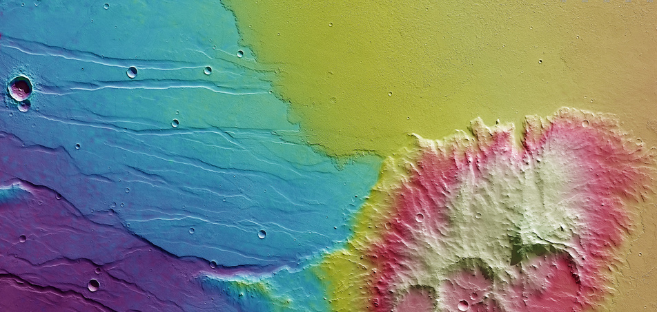 This color-coded topography map of Daedalia Planum, released on March 5, 2014, shows a segment of highland terrain that is home to Mistretta Crater, the largest of the three eroded impact craters on Mars. White and red show the highest terrains, while blue and purple show the deepest.
