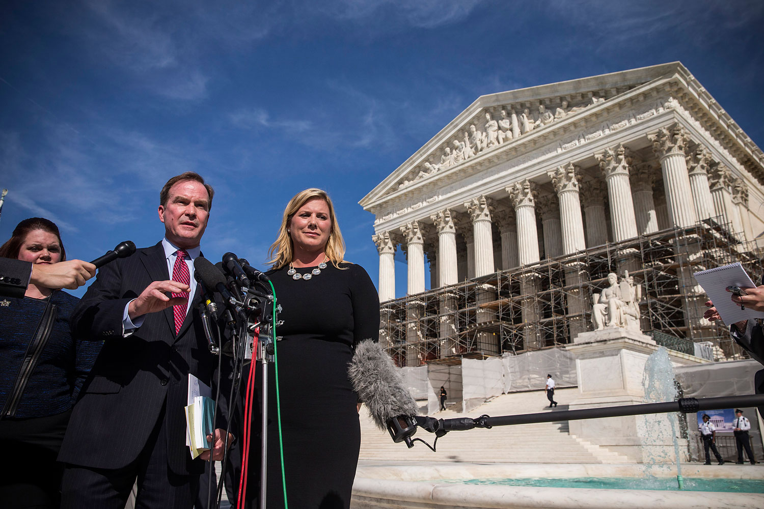 Jennifer Gratz, right, CEO of XIV Foundation and Michigan Attorney General Bill Schuette speak during a press conference outside the Supreme Court after going before the Supreme Court in 