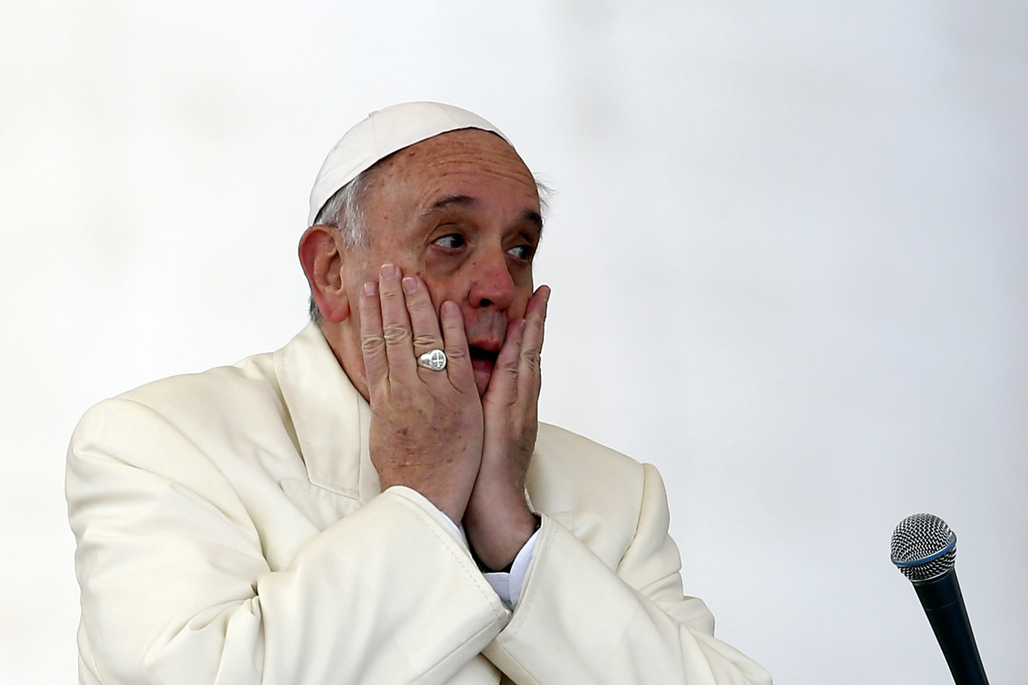 Pope Francis reacts as he leads a Wednesday general audience in Saint Peter's square at the Vatican