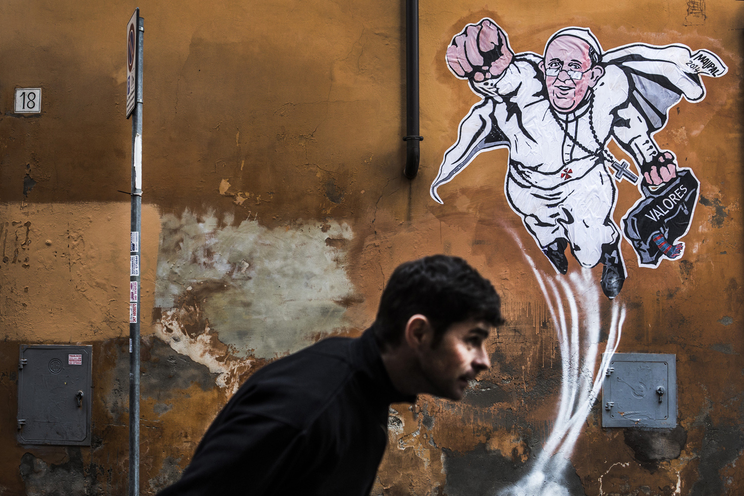 Italy - Feature - First Pope Francis graffiti murales appears in Rome